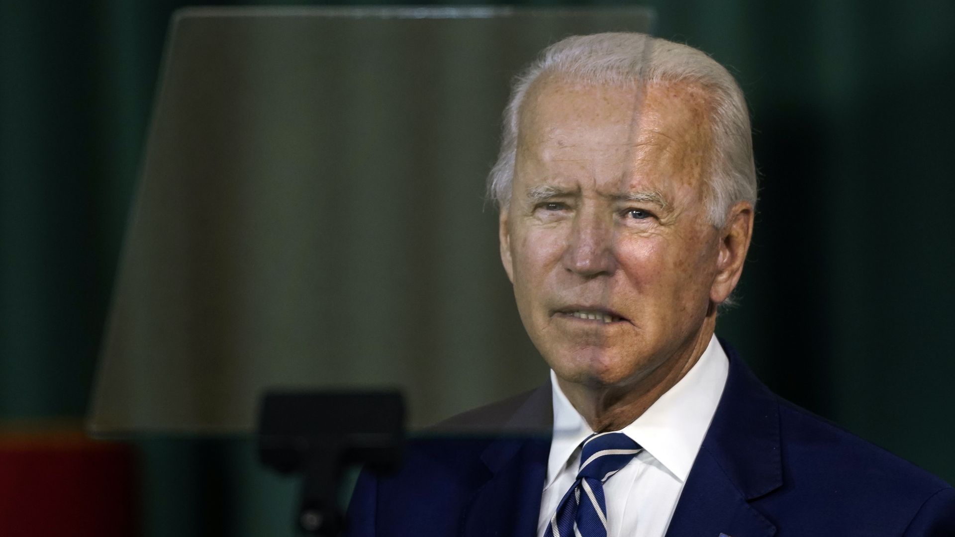 Vice President Joe Biden sitting behind a glass