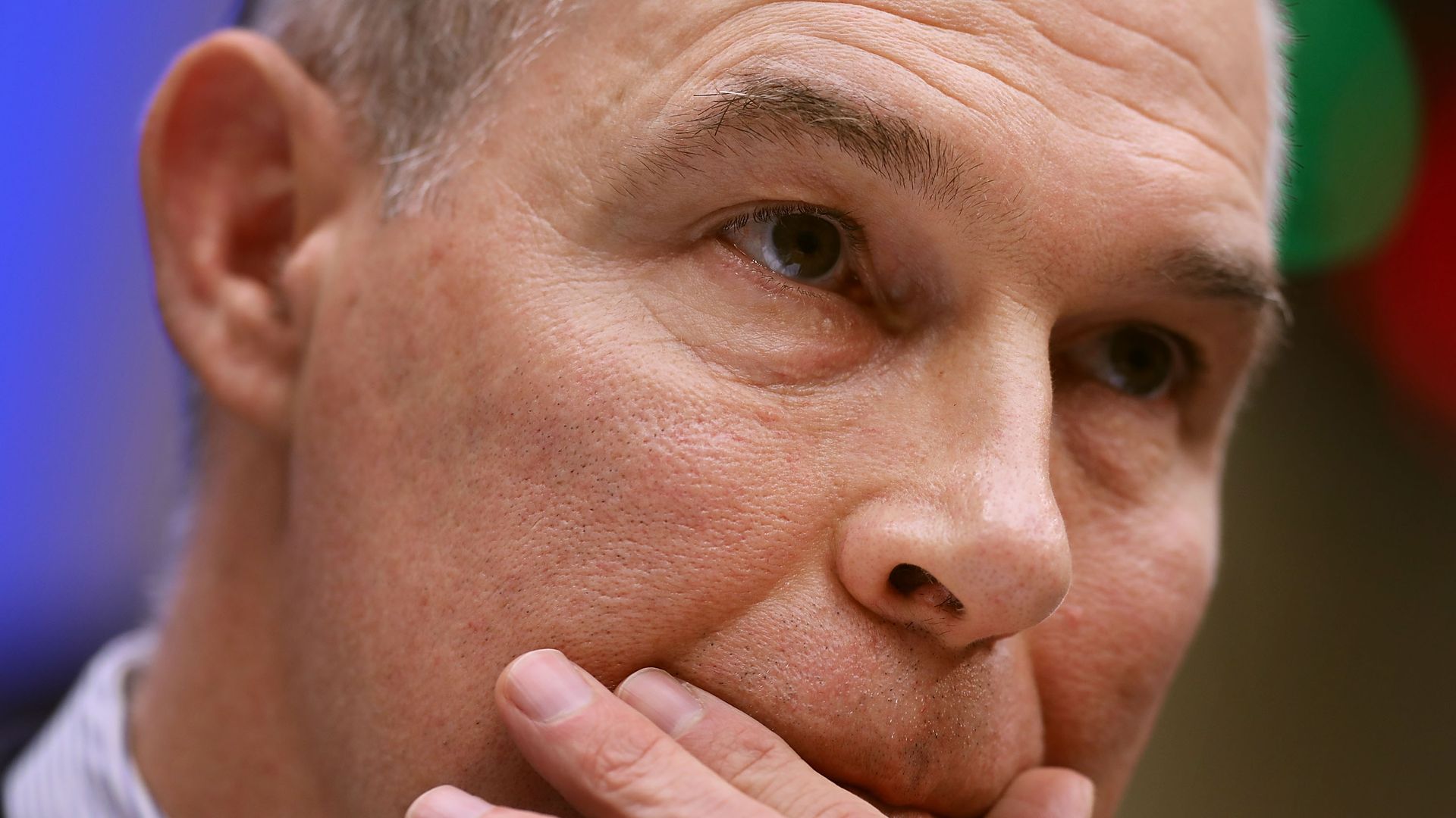 Scott Pruitt touches his face.