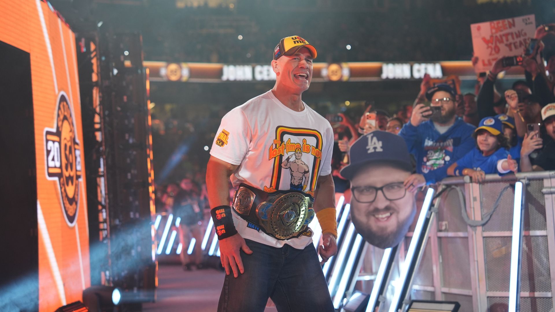 John Cena at a wrestling event inside packed arena