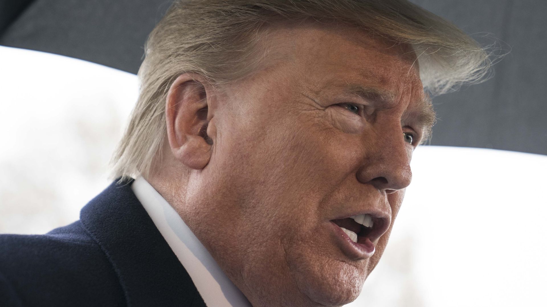 In this image, Trump talks