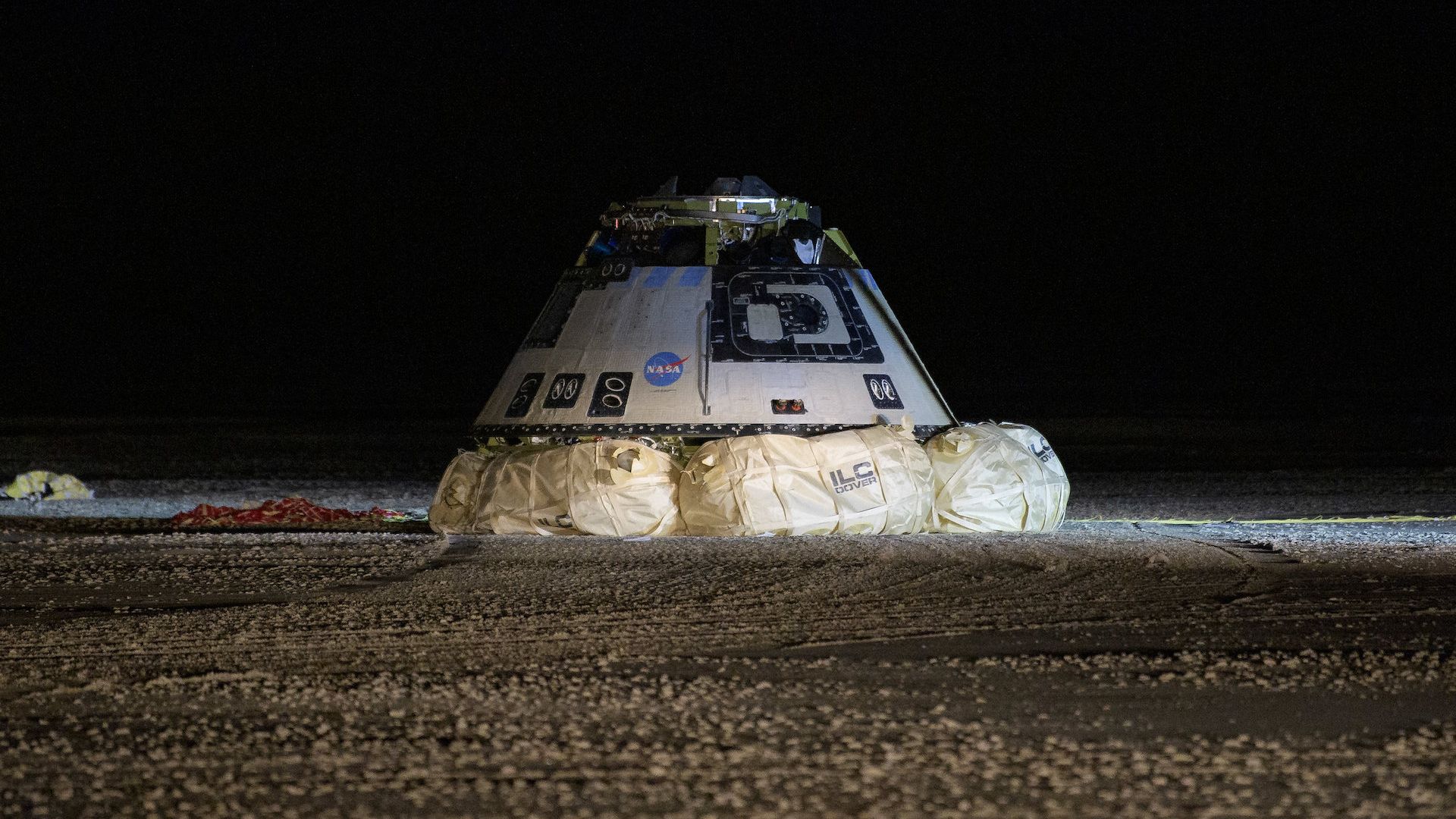Boeing's Starliner back on the ground in the dark after landing on Earth