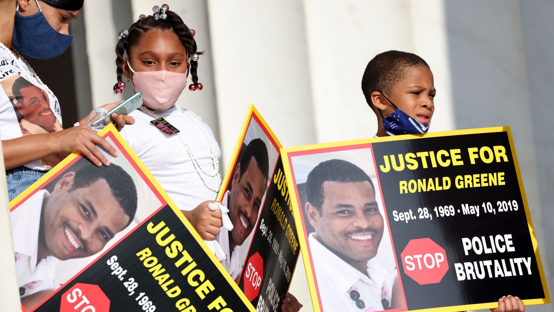 Family members of Ronald Greene listen to speakers as they gather at the Lincoln Memorial for the March on Washington August 28, 2020 in Washington, DC.