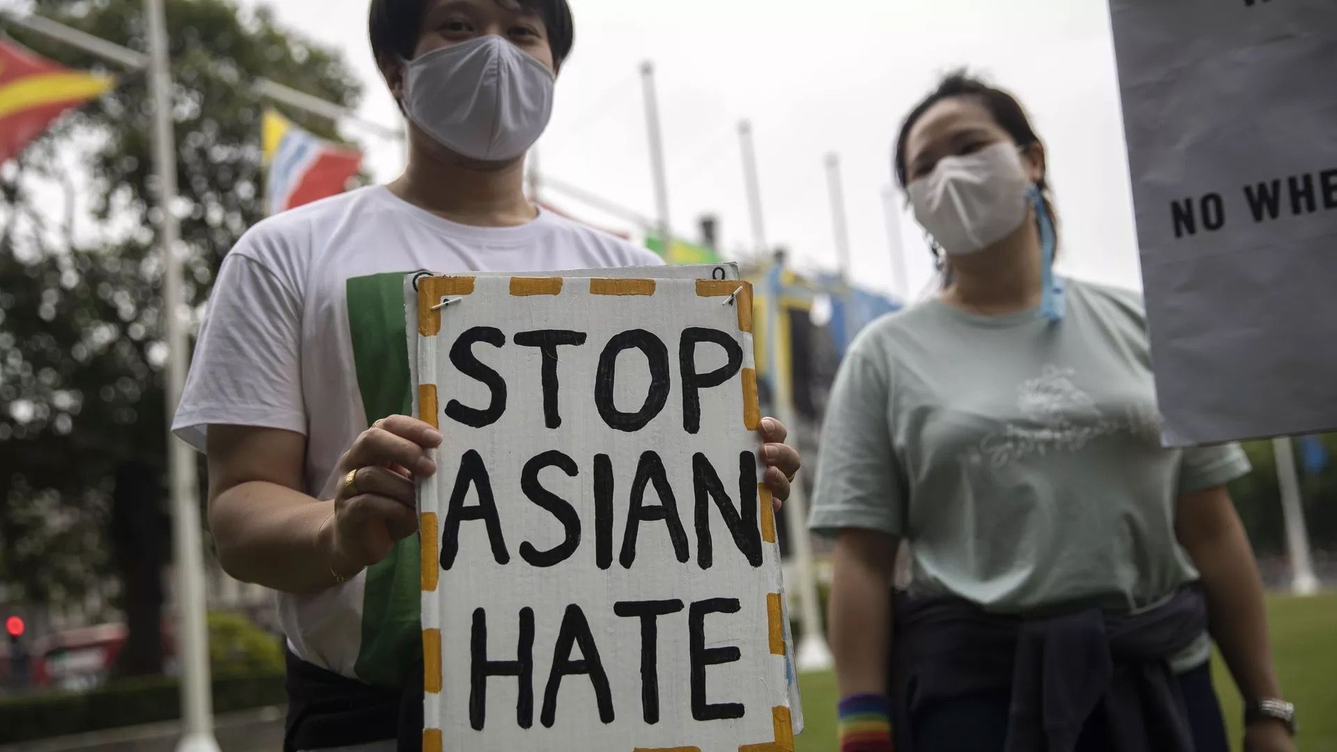 A person at an anti-Asian hate rally is seen.