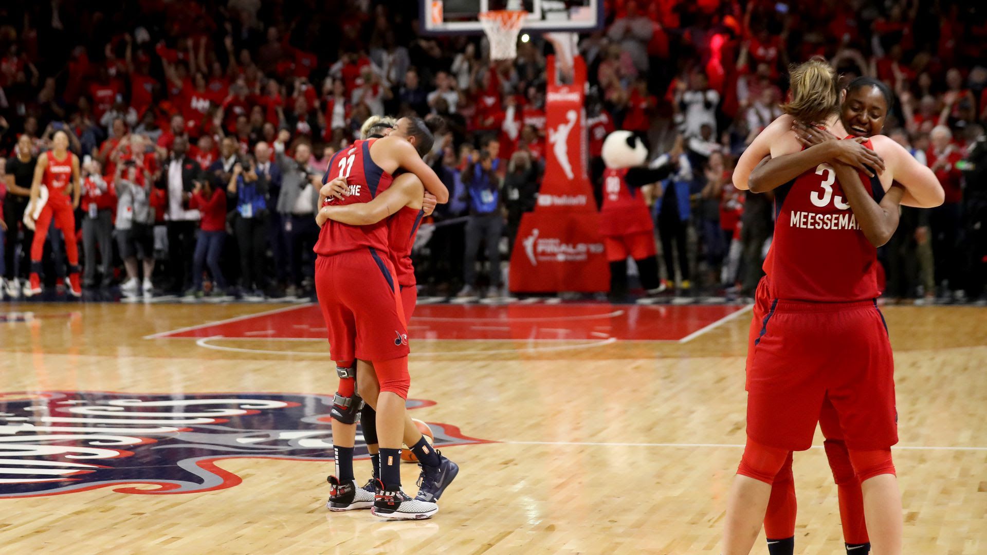 Mystics player celebrate winning the WNBA
