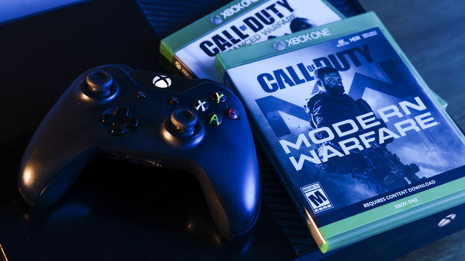 Photo of two Call of Duty video game boxes and one Xbox One controller