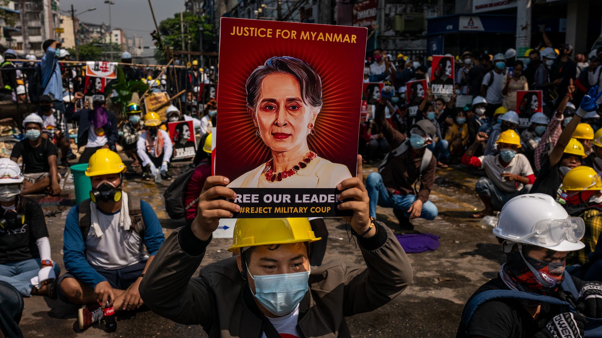  An anti-coup protester holds up a placard featuring de-facto leader Aung San Suu Kyi on March 02, 2021