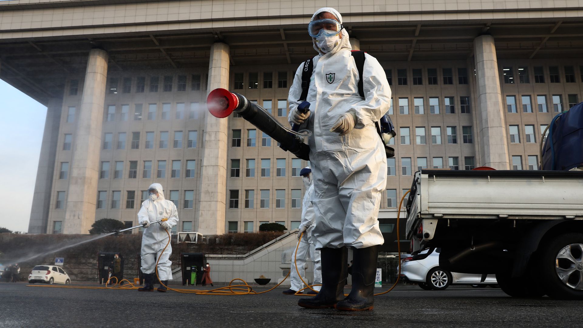 Health workers spray disinfectant in Seoul