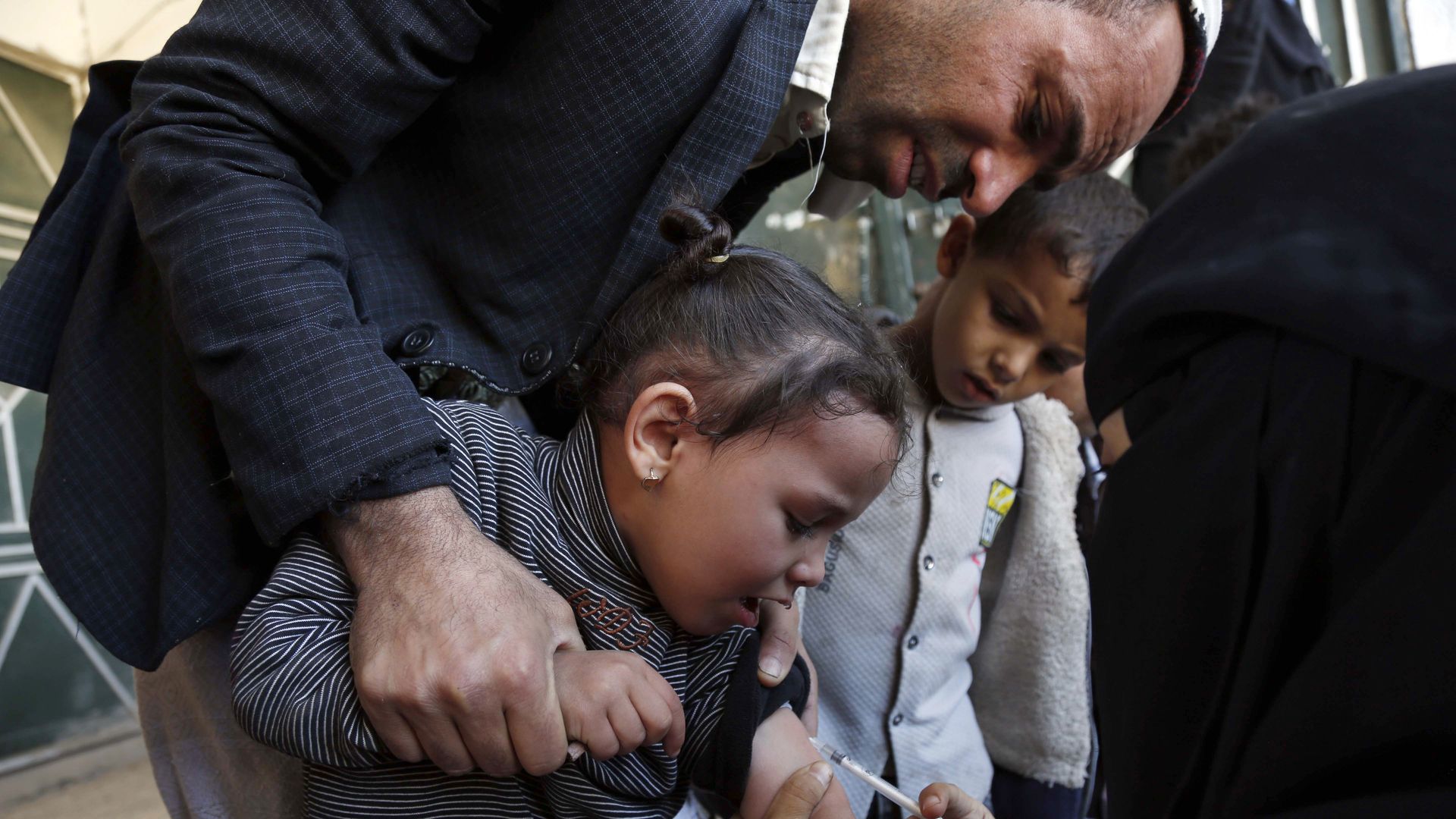Yemeni children receive doses of vaccines against measles and polio as part of vaccine campaign launched in Sanaa, Yemen on December 20, 2021.
