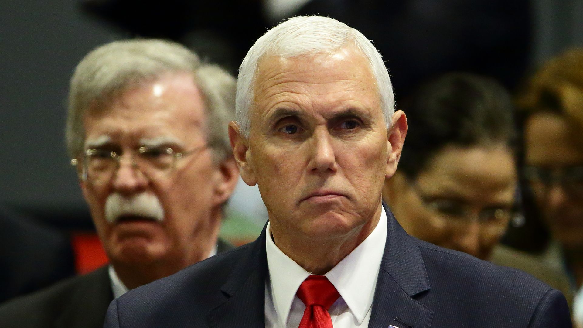 Vice President Mike Pence with John Bolton behind him.