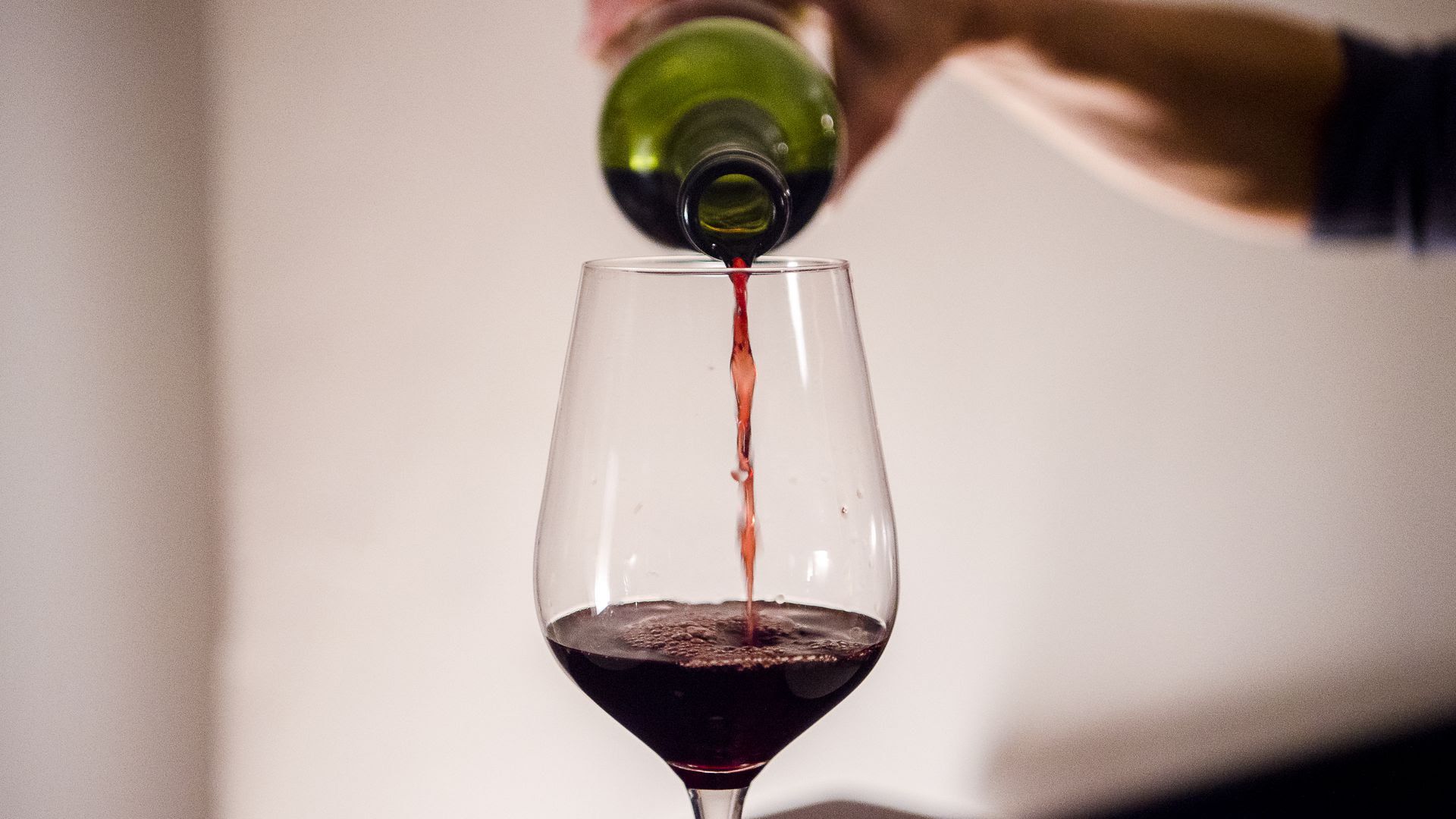Red wine being poured into a glass