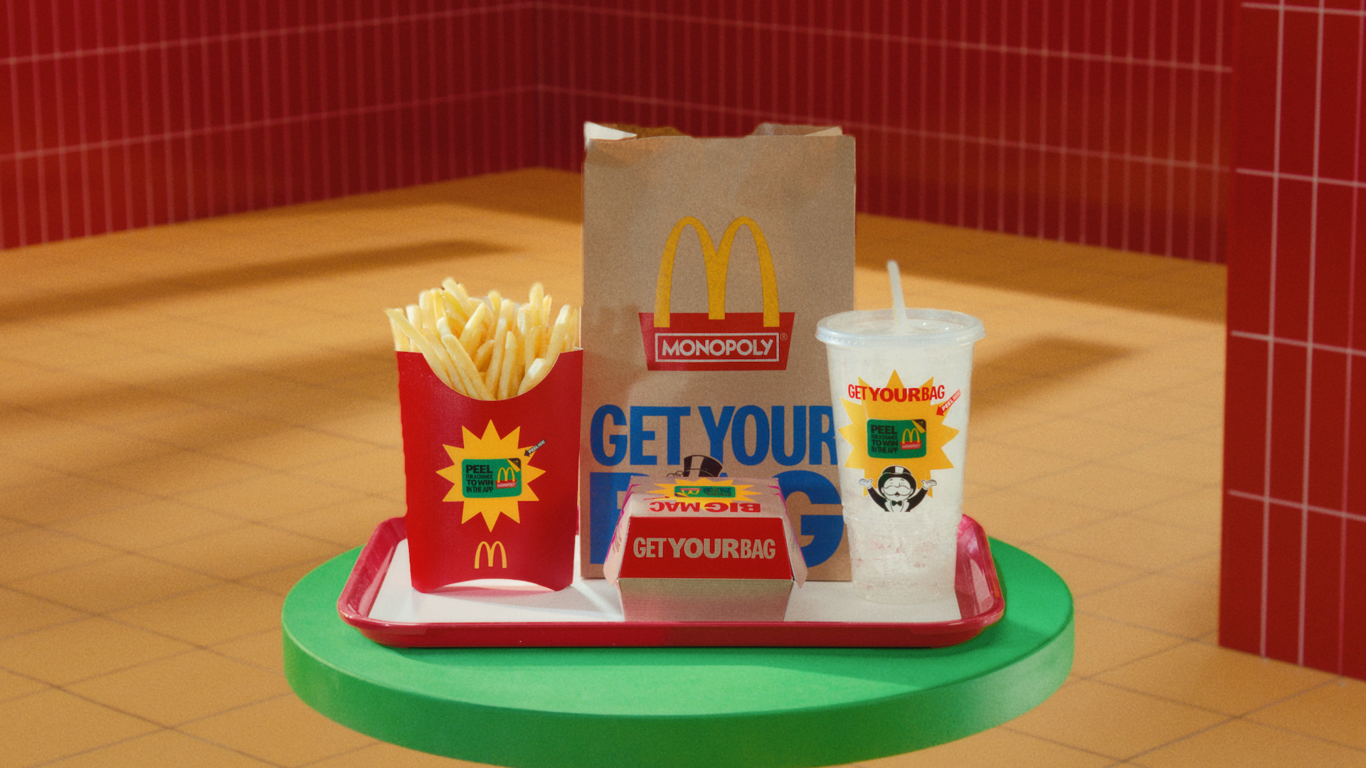 McDonald's tray with food on it with Monopoly game pieces displayed.