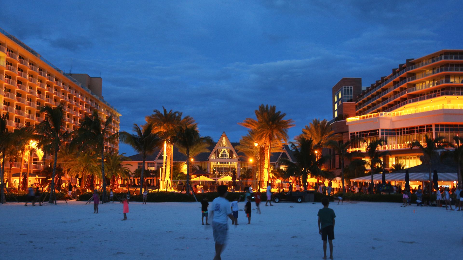 Tourists relax in the evening on San Marco Beach by the JW Marriott Marco Island Beach Resort on Marco Island, Florida, USA.