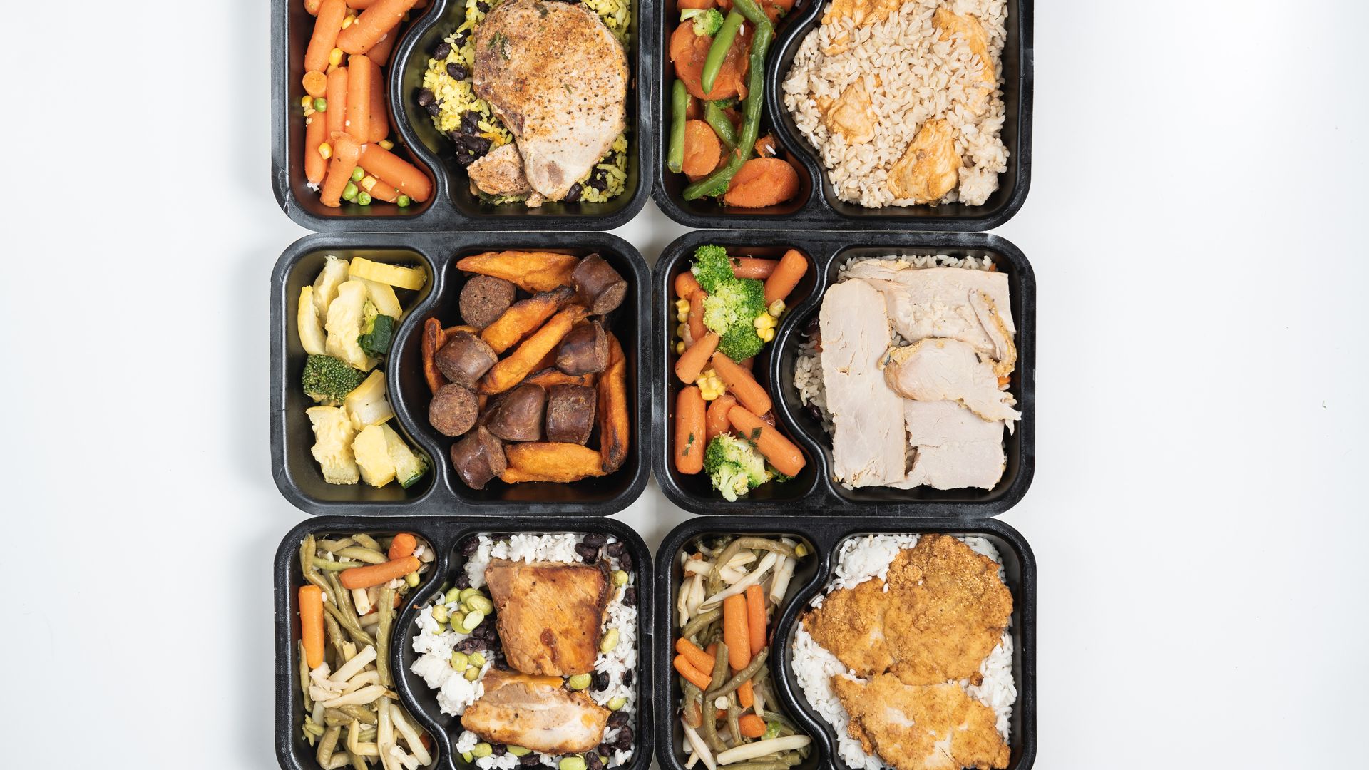 Six trays of microwavable meals, including chicken or sausage, rice and carrots and broccoli and other vegetables. The food came from leftovers restaurants and other vendors.