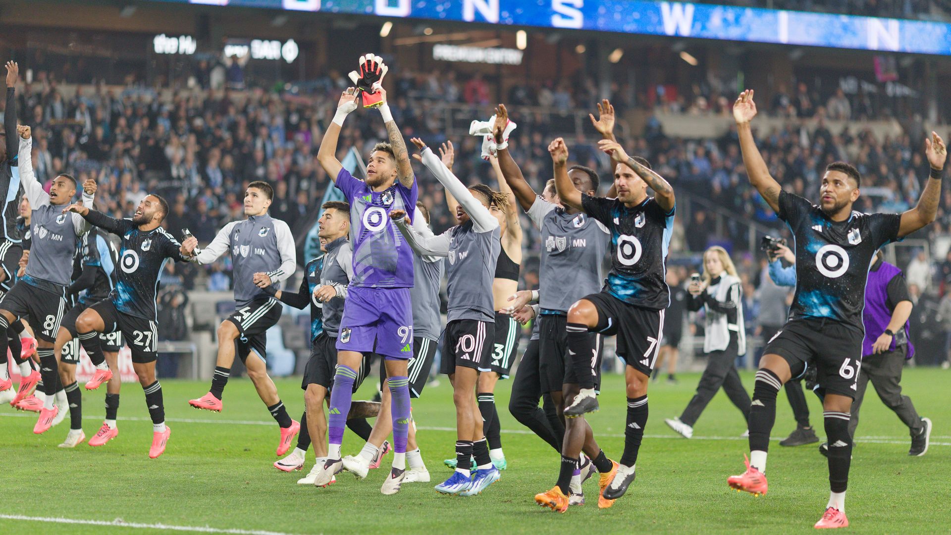 A photo of Loons players celebrating on the field at Allianz Field