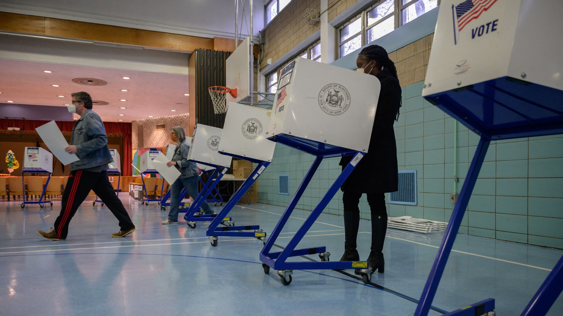 Voters cast their ballots at a voting center in Brooklyn, New York on November 2, 2021.
