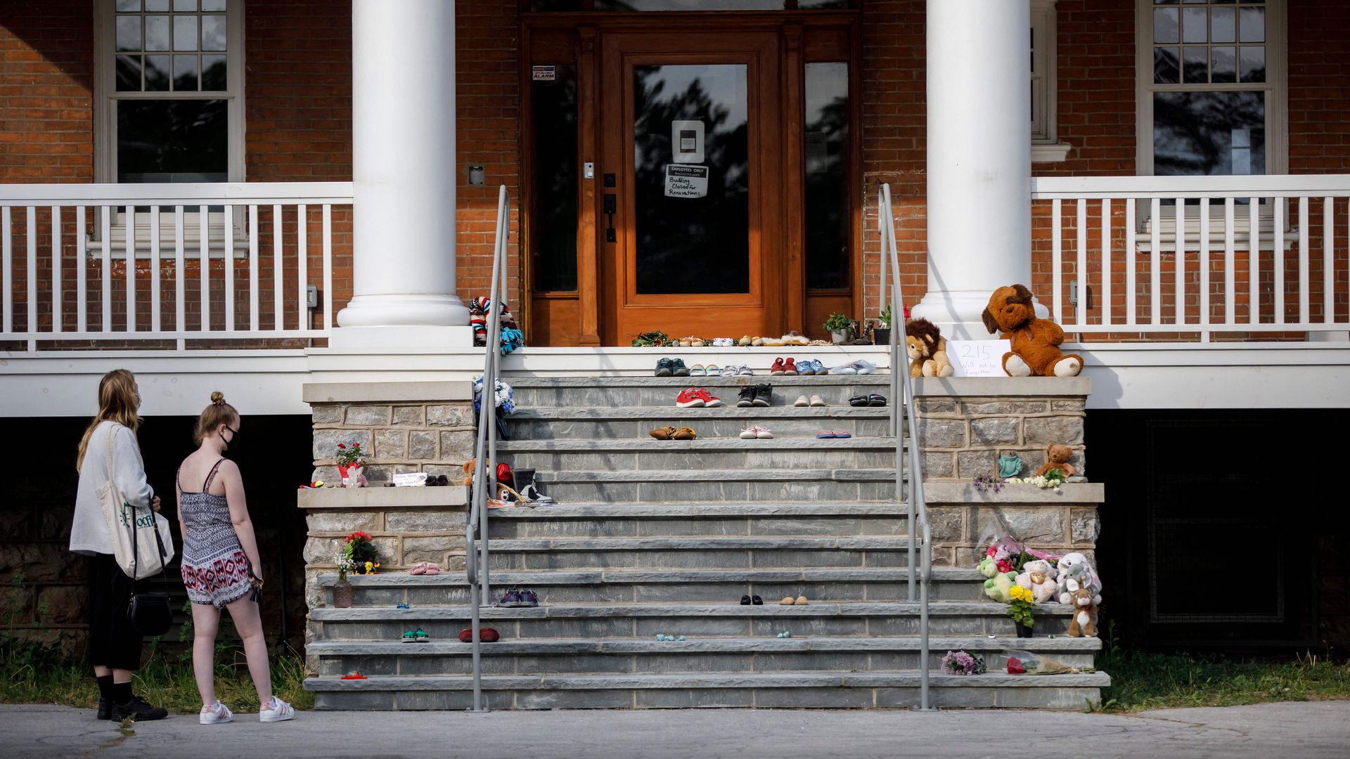 People at a memorial for 215 kids whose remains were found in a  grave in Brantford, Ontario, Canada on May 31.