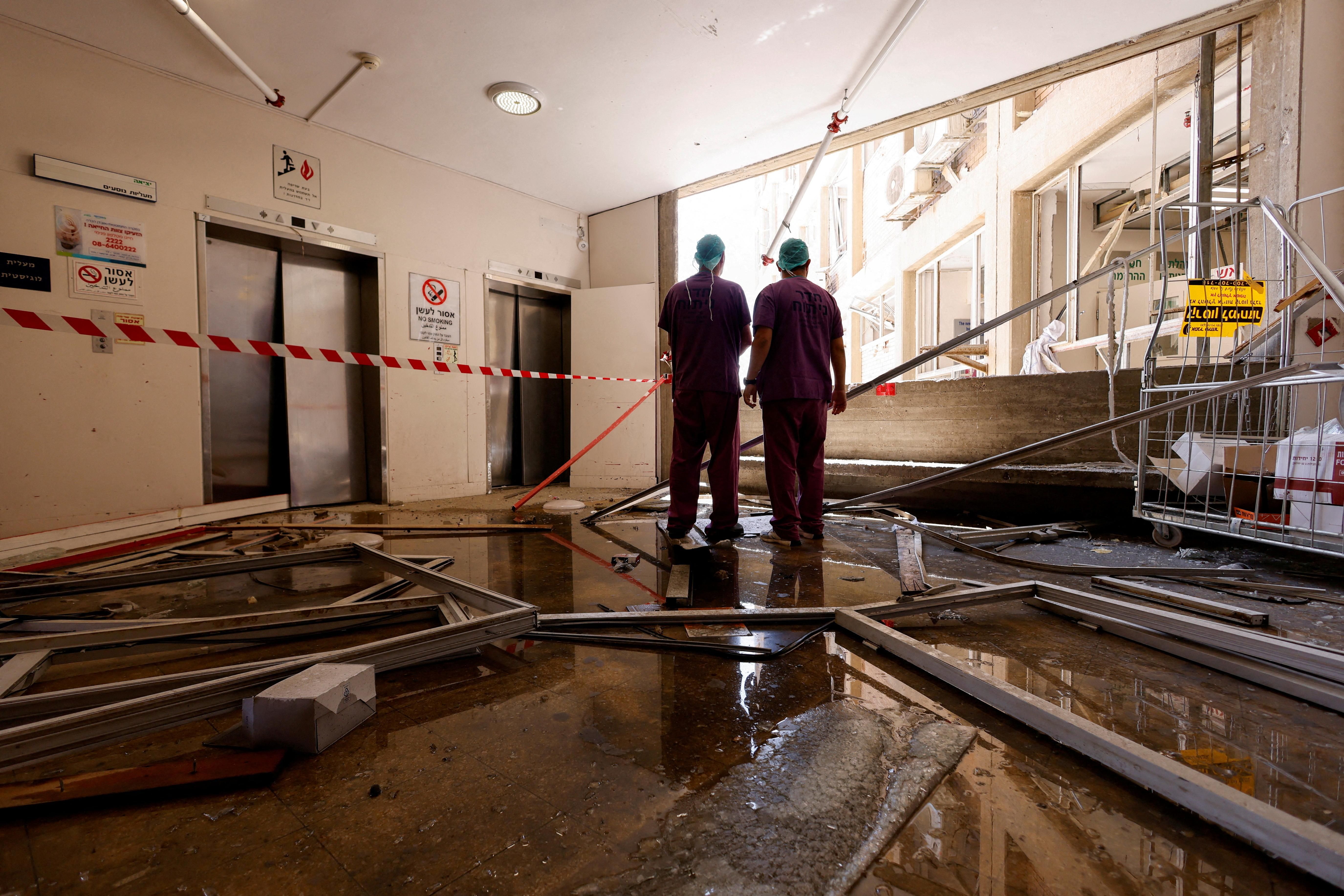 Medical staff inspect the damage from an Iranian missile strike yesterday on Soroka Medical Center, a hospital in Beersheba, Israel.