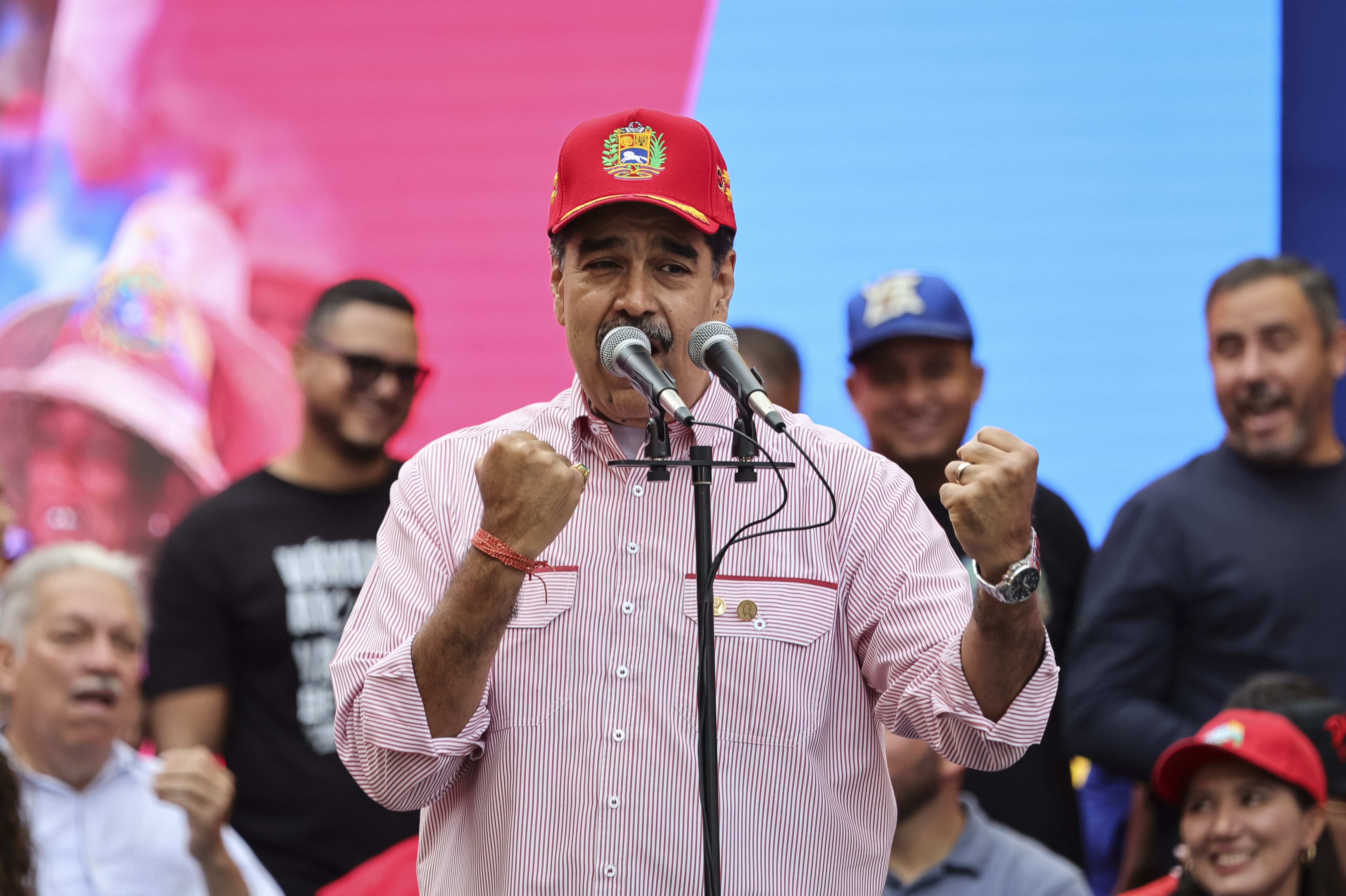  President Nicolas Maduro of Venezuela makes a gesture during a protest to support him on December 1, 2025 in Caracas, Venezuela. Supporters gathered at Miraflores to show support and to be part of the swearing-in of the 'Integral Bolivarian Community Commands.' (Photo by Jesus Vargas/Getty Images)