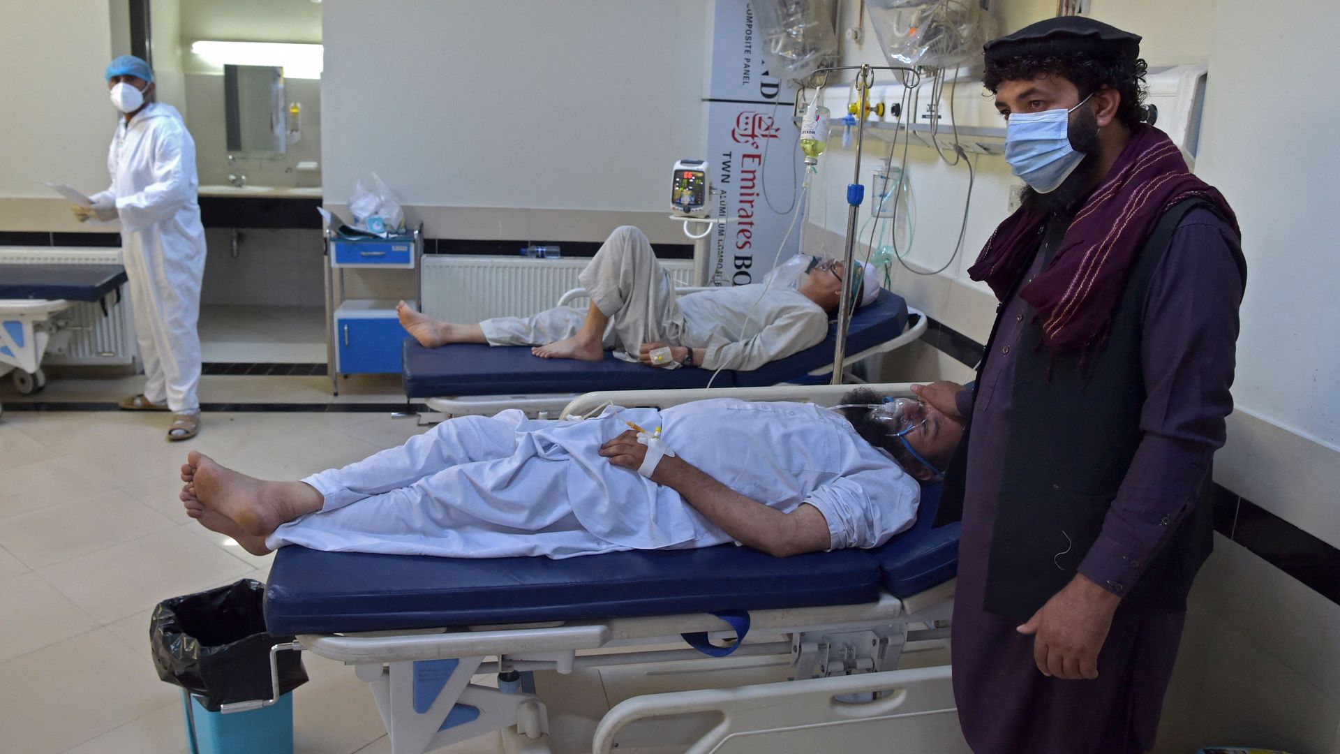 A family member beside a COVID-19 patient at the Muhammed Ali Jinnah hospital in Kabul, Afghanistan, in June.