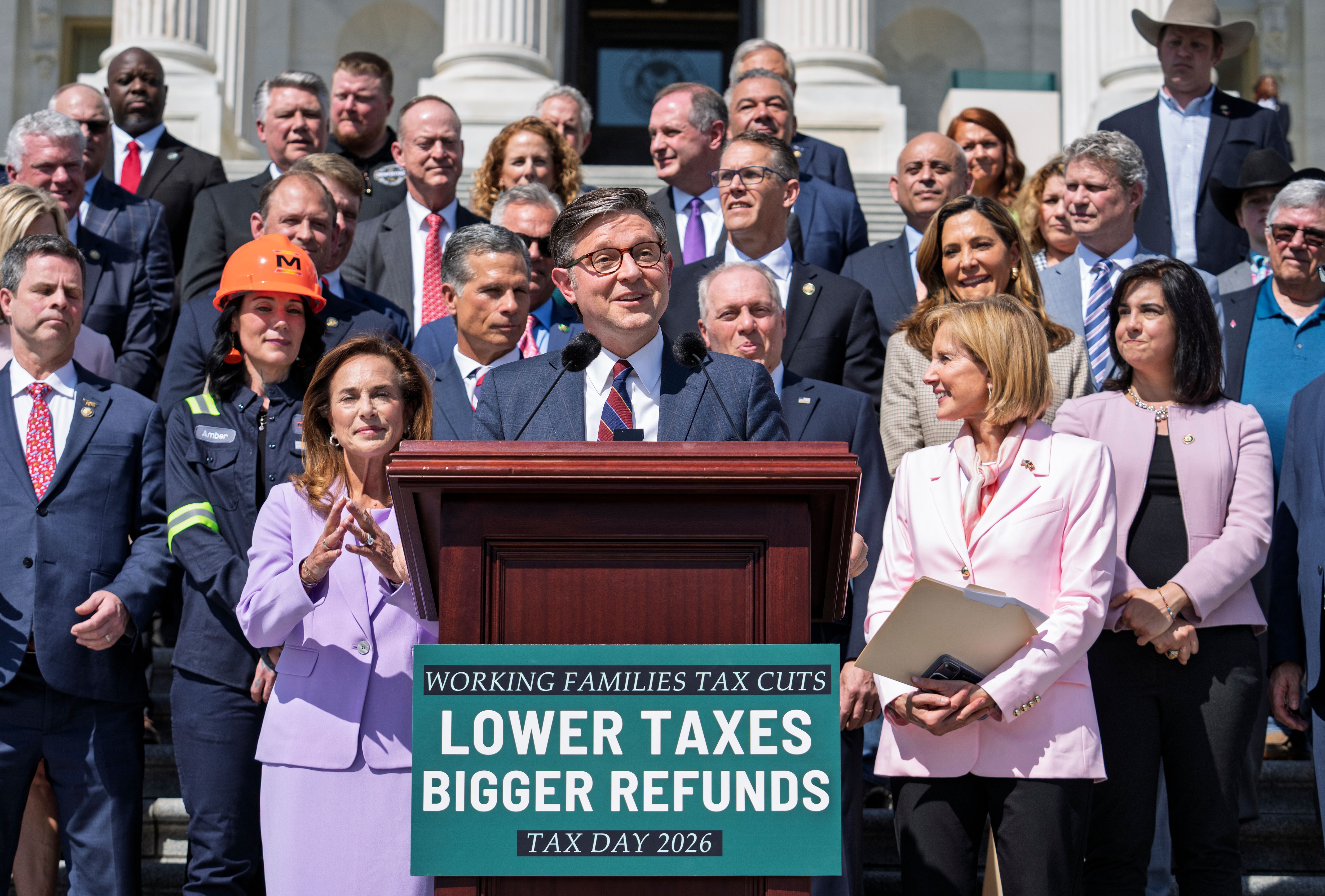 Speaker of the House Mike Johnson, R-La., and fellow Republicans celebrate GOP tax policies at an event outside the Capitol in Washington, Wednesday, April 15, 2026. (AP Photo/J. Scott Applewhite)