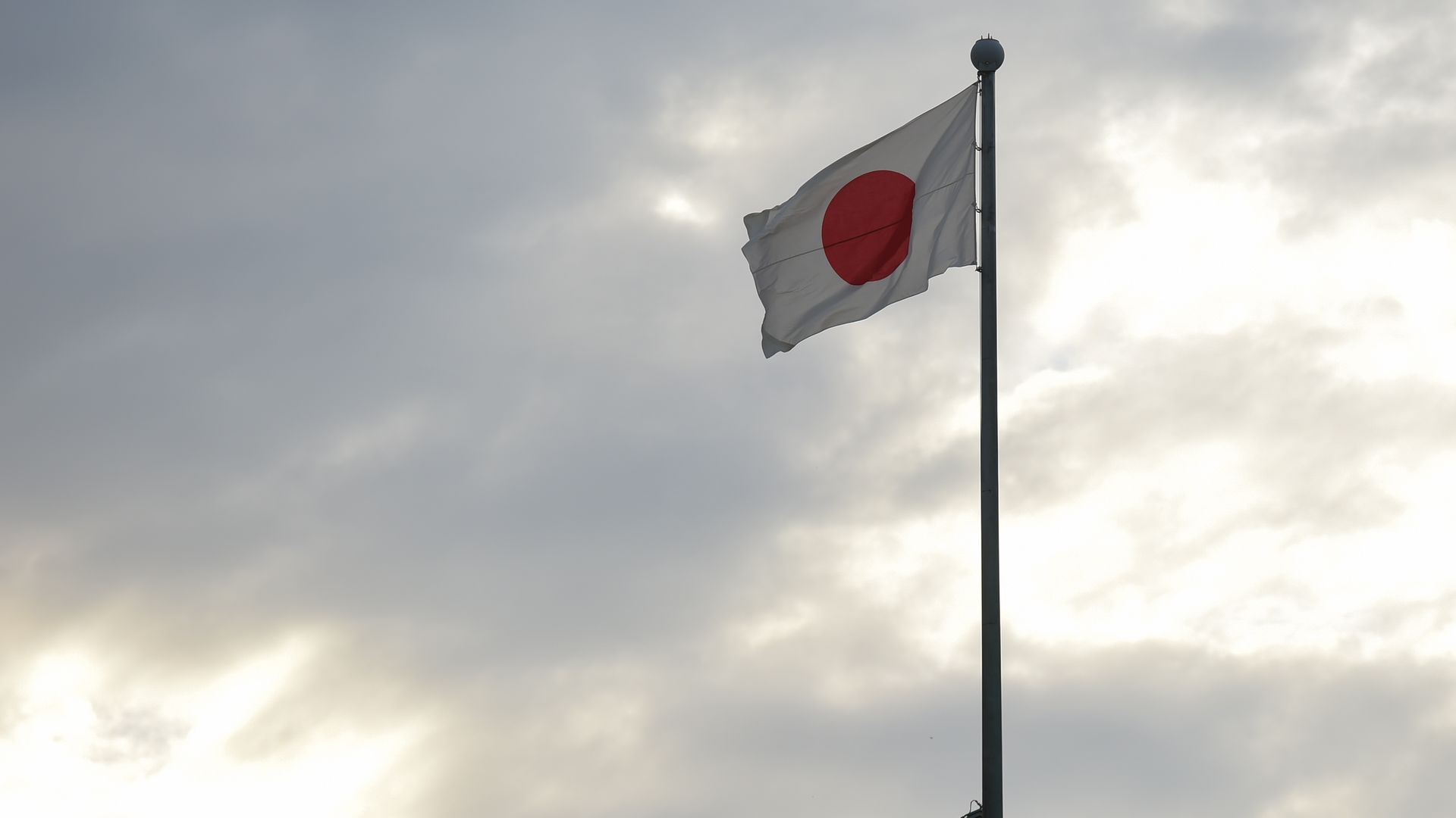 Japanese flag on a pole.