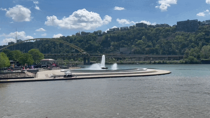 A panning shot on the Allegheny River of the Point State Park fountain from a boat.