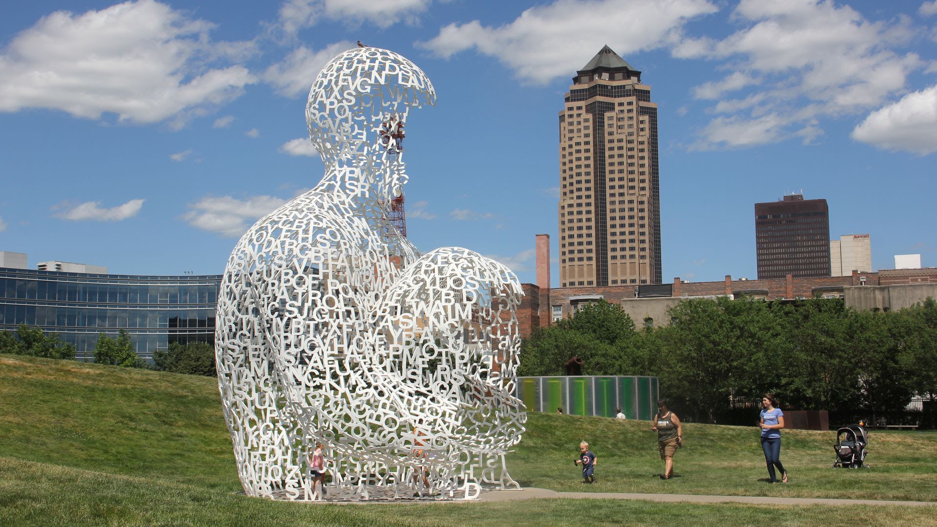 The Nomade sculpture stands by a grassy knoll at the Pappajohn Sculpture Park.