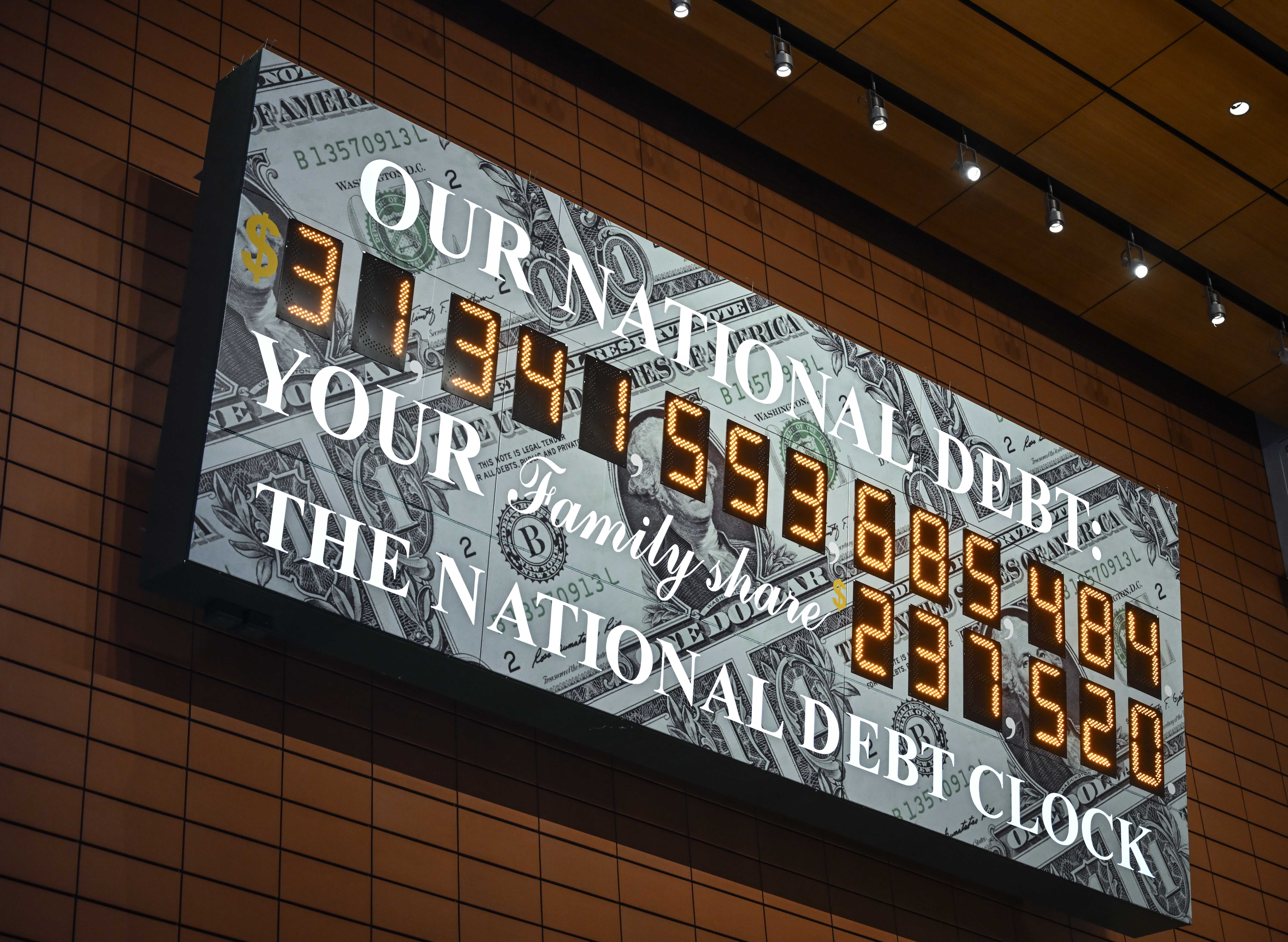 A screen shows the national debt clock after the US hit its debt limit and the Treasury started using "extraordinary measures" to avoid default on Jan. 19, 2023.