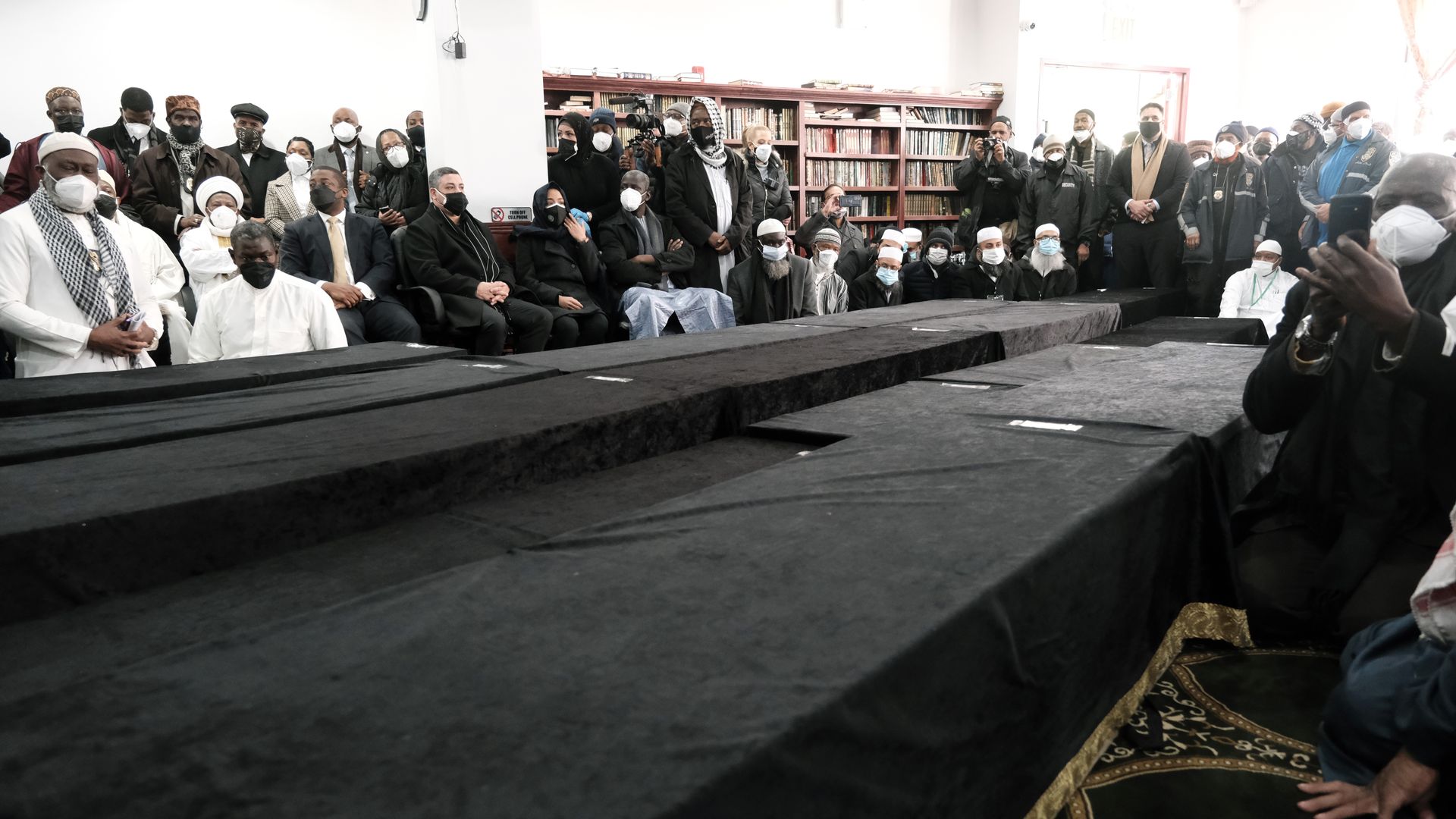 Hundreds of people attend a mass funeral for 15 of the 17 victims of a fire in a Bronx apartment building