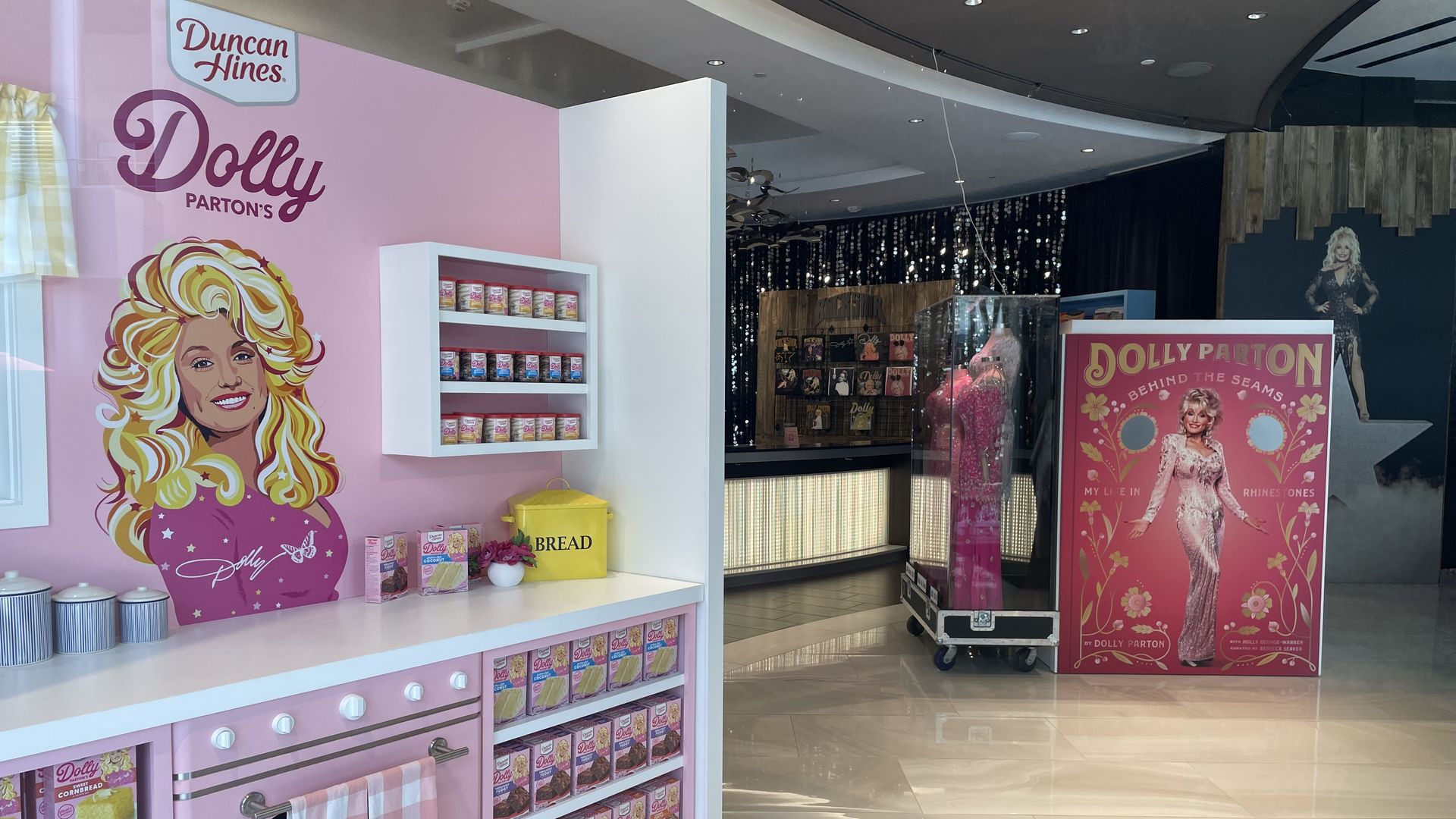 A Dolly Parton Duncan Hines display and other Dolly Parton displays behind that.