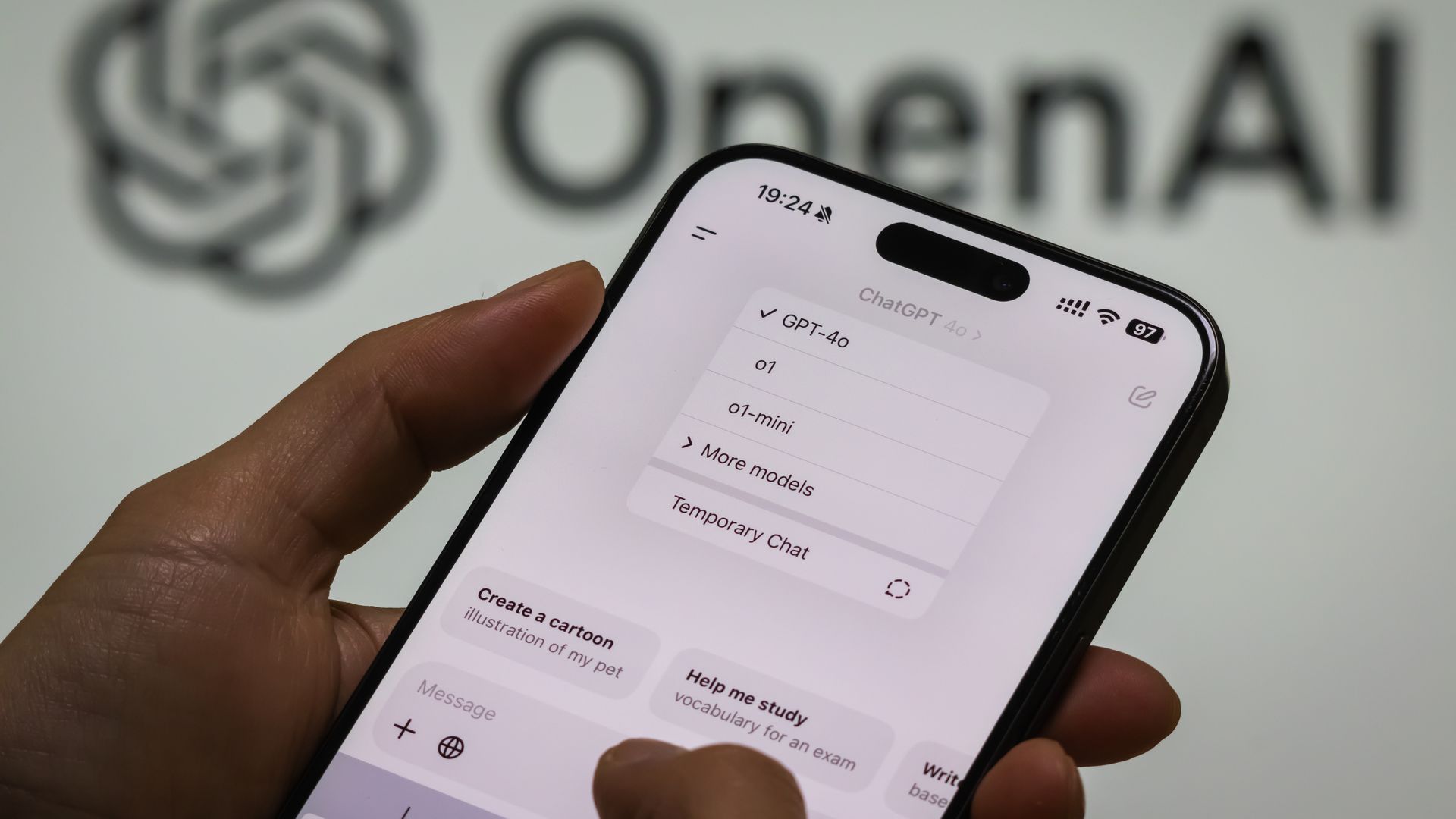 In this photo illustration, a person interacts with the ChatGPT application on a smartphone.