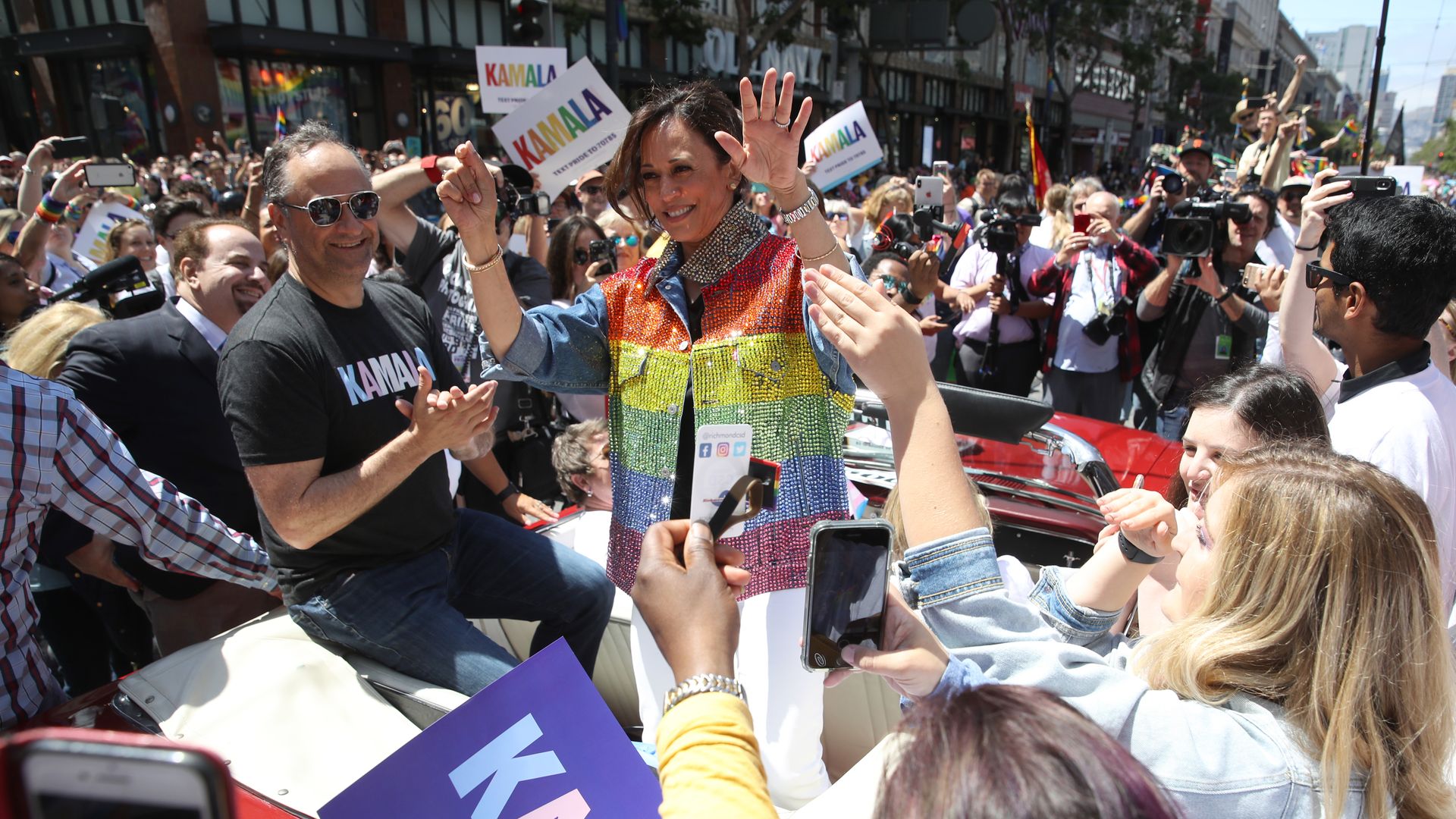 Democratic presidential candidate U.S. Sen. Kamala Harris (D-CA) waves as she rides in a car during the SF Pride Parade on June 30, 2019 in San Francisco, California. 