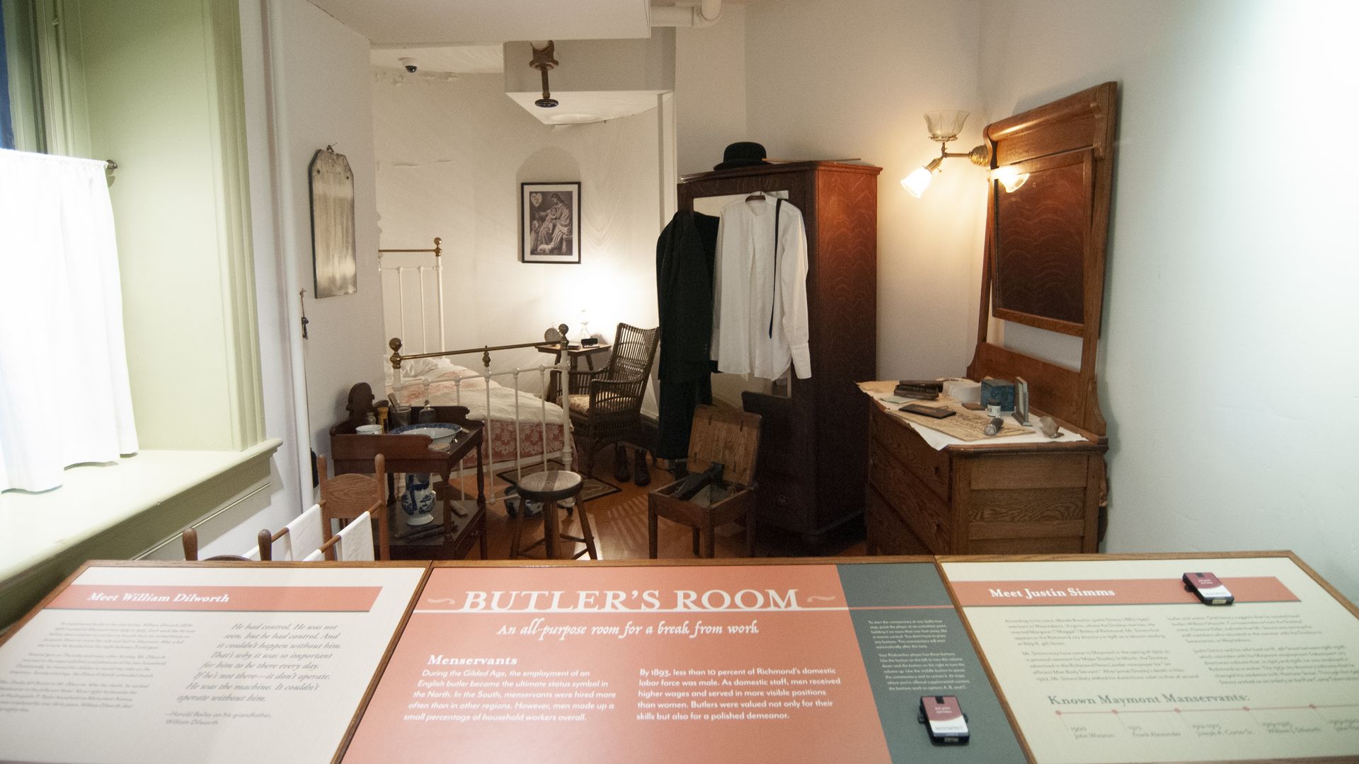 A small room with a small bed labeled butlers room