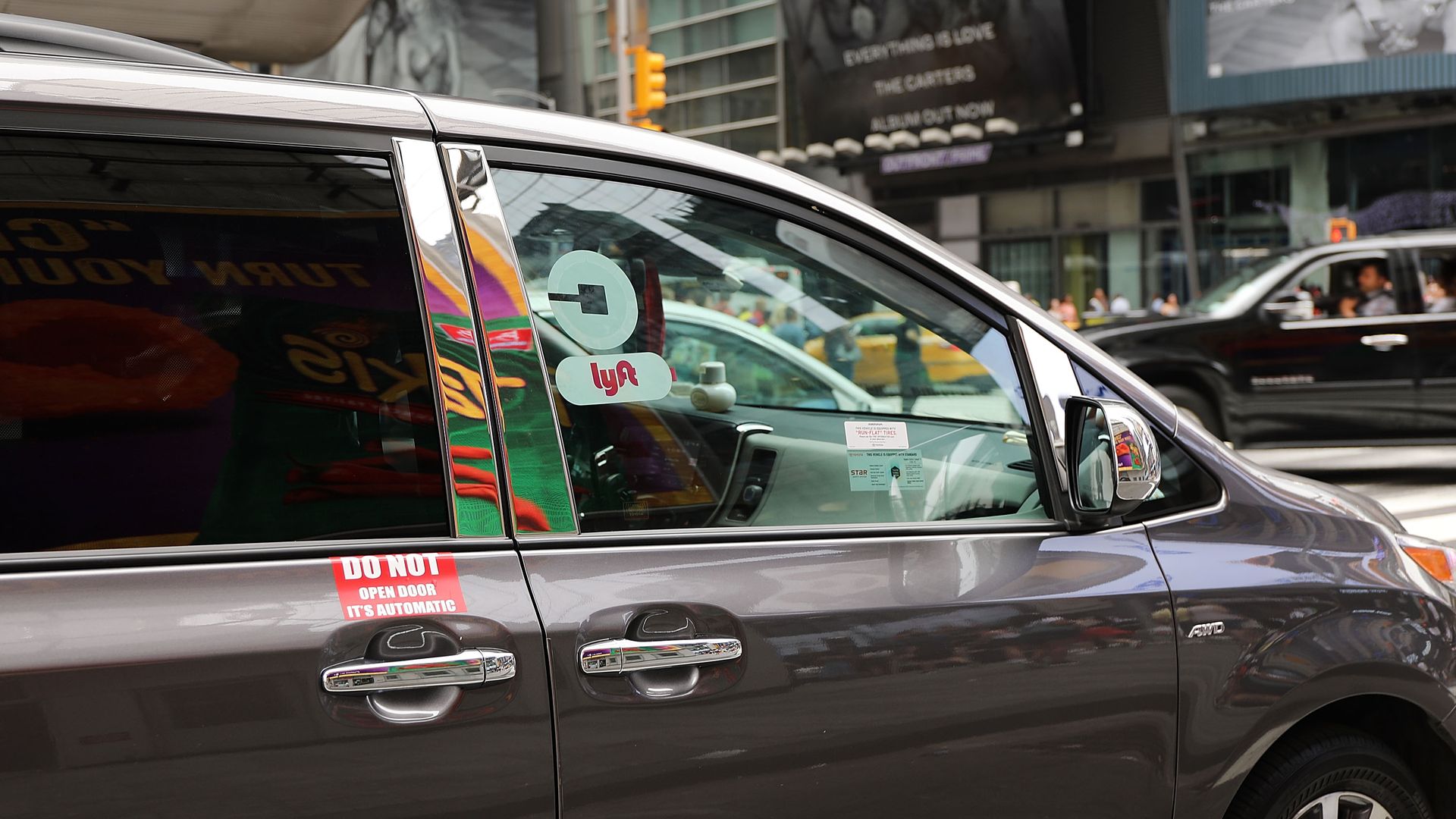 A Lyft ride hailing vehicle moves through traffic in Manhattan on July 30, 2018 in New York City.