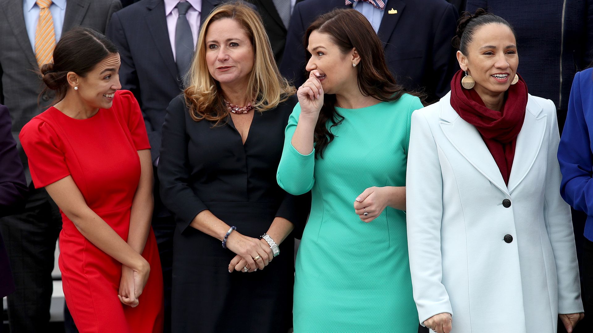 Alexandria Ocasio-Cortez, Debbie Mucarsel-Powell, Abby Finkenauer, and Sharice Davids pose for a picture at the U.S. Capitol. 