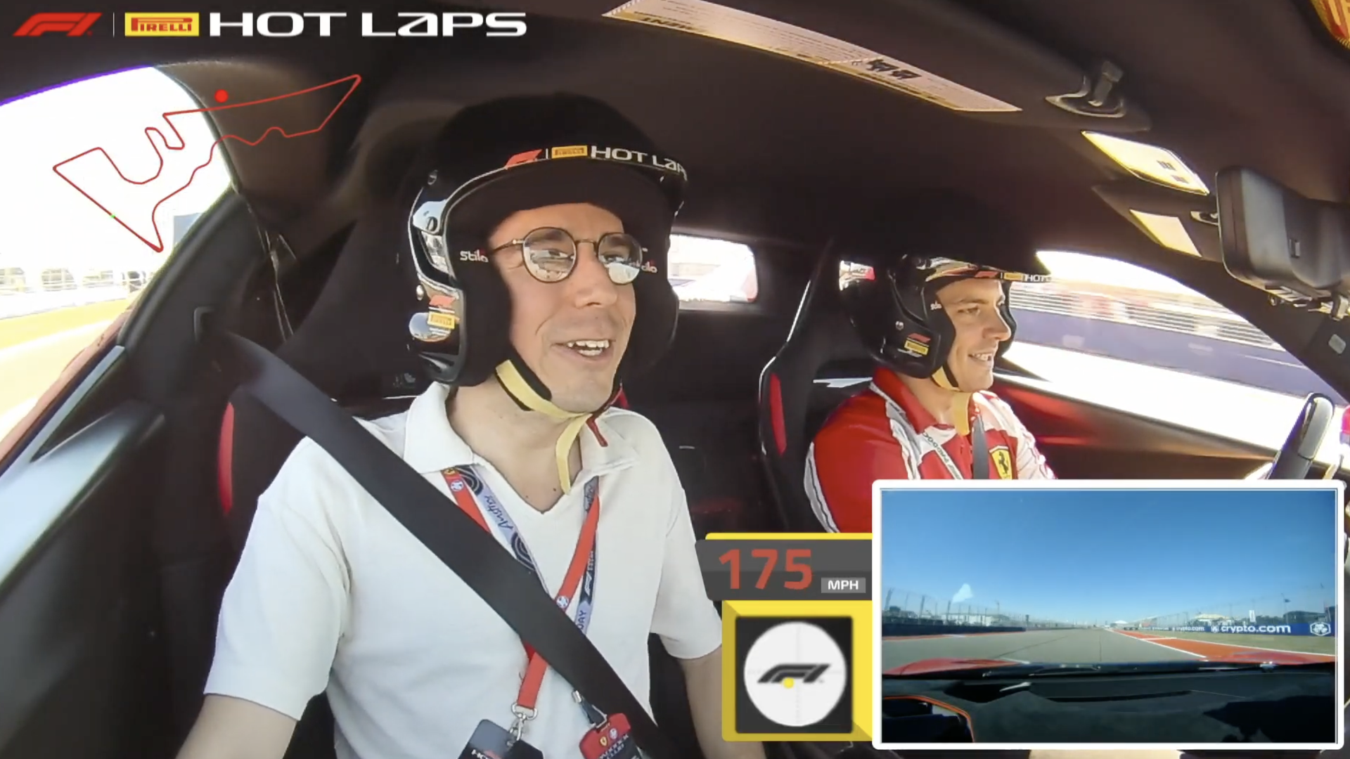 Inside a race car cockpit, two men wear helmets and seat belts. On-screen graphics show 175 MPH and a track inset labeled "HOT LAPS".