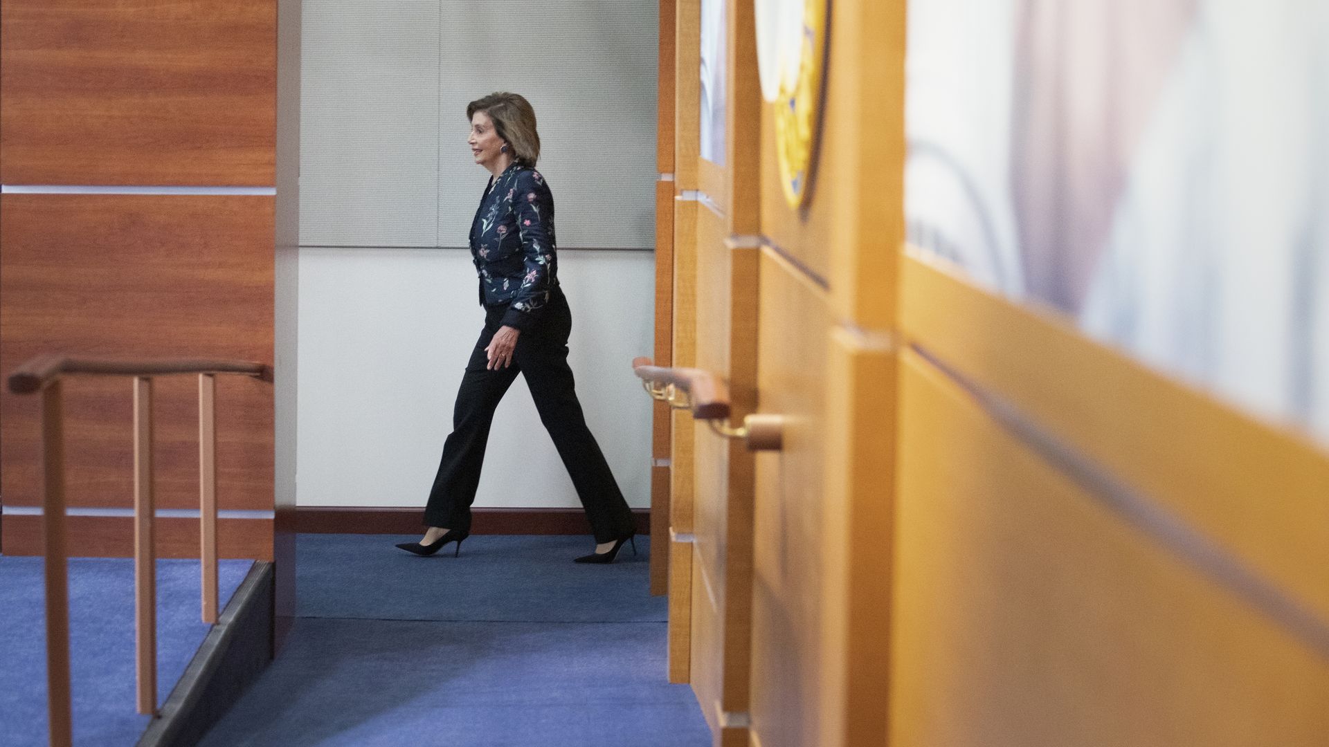 House Speaker Nancy Pelosi is seen walking to her weekly news conference.