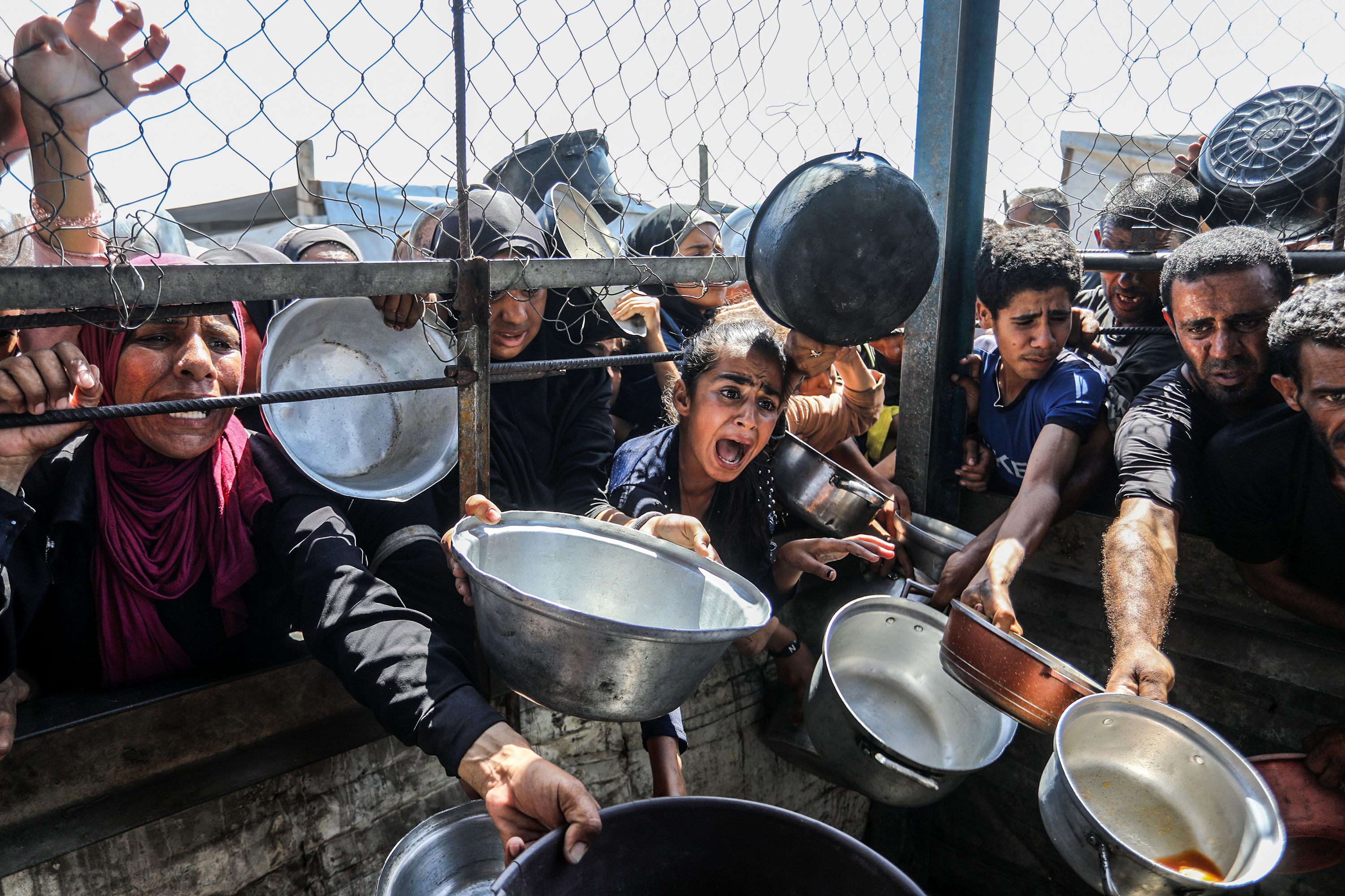 People line up to receive food