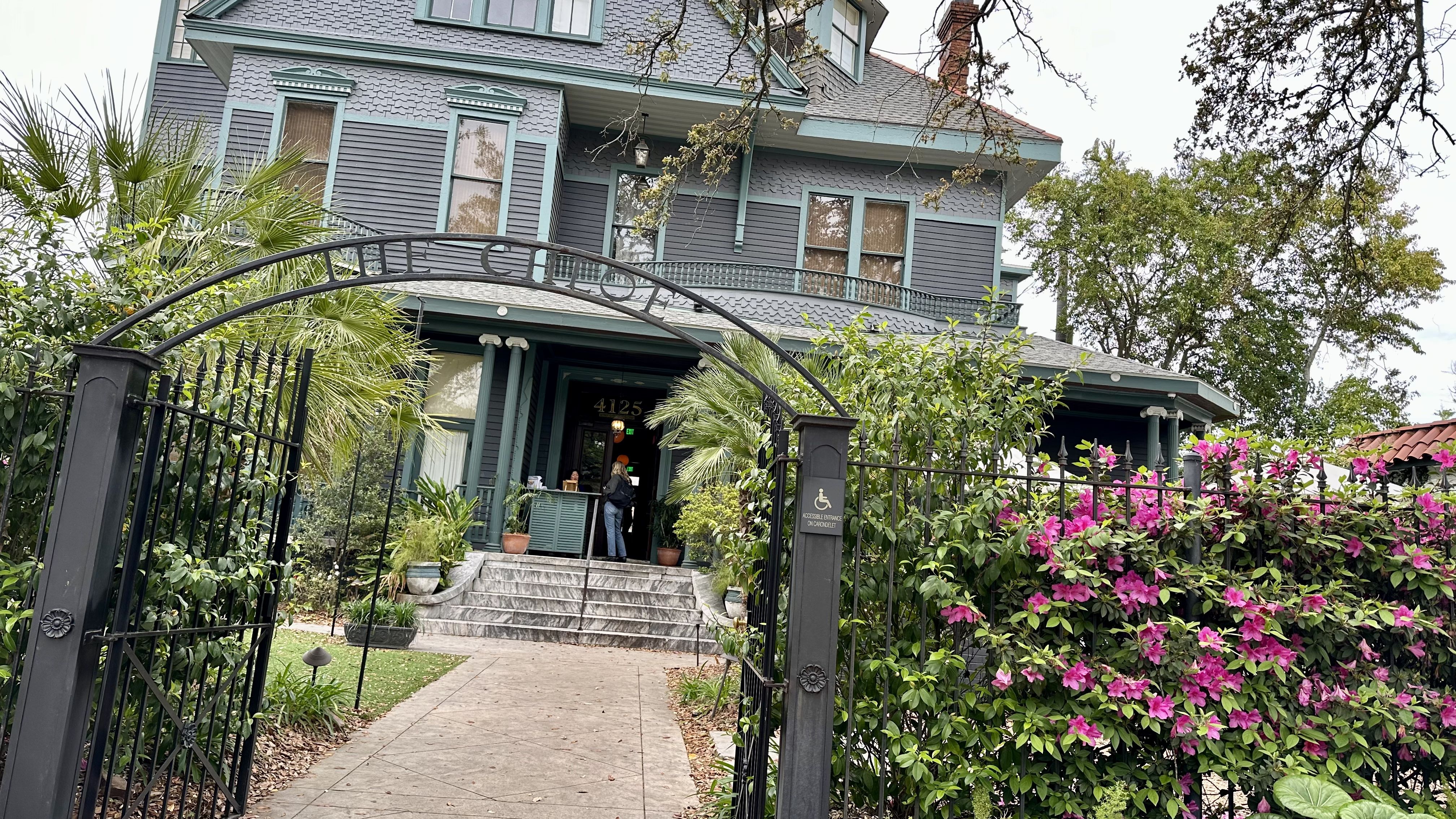 Photo shows the exterior of The Chloe with a big gate.