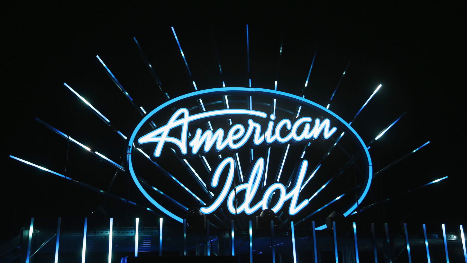 An illuminated sign logo of the American Idol TV show.