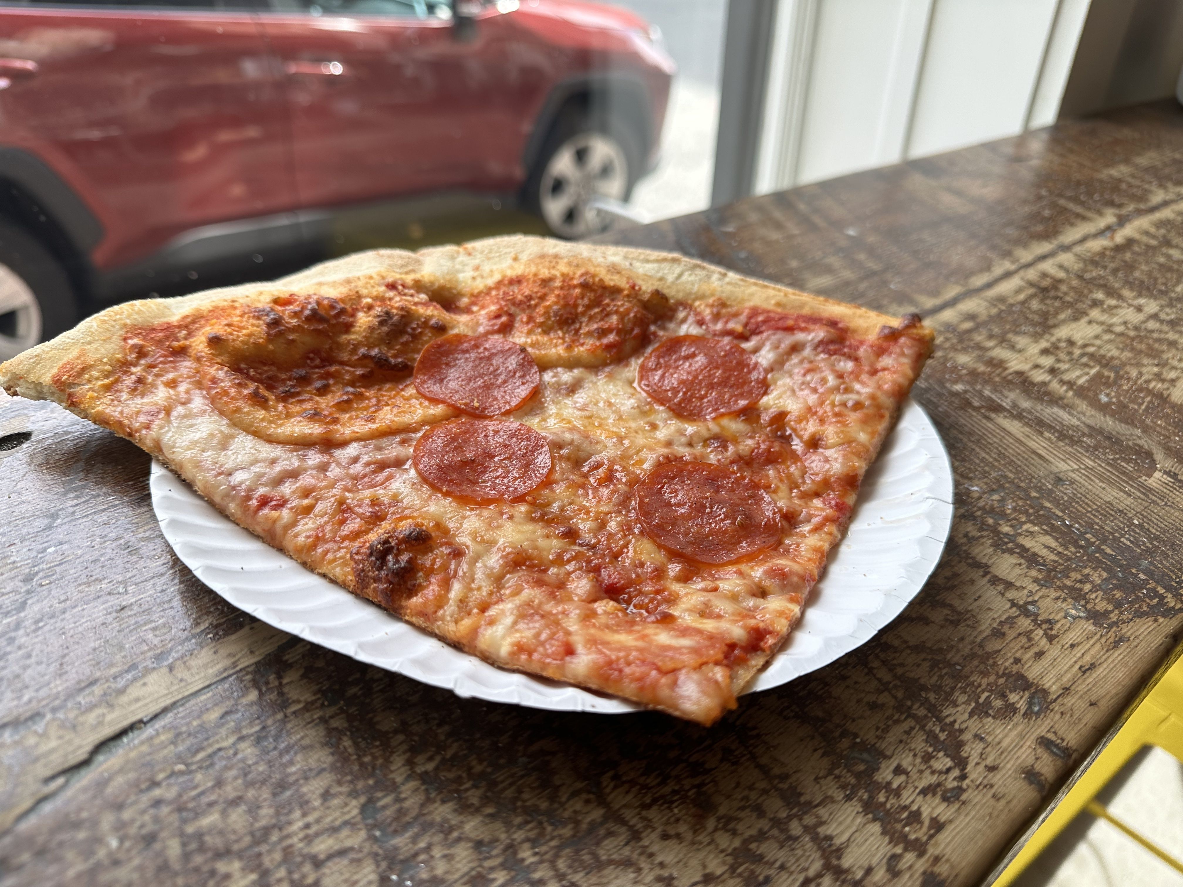 A massive slice of pepperoni pizza -- two slices worth -- at Florina Pizzeria on Beacon Hill.