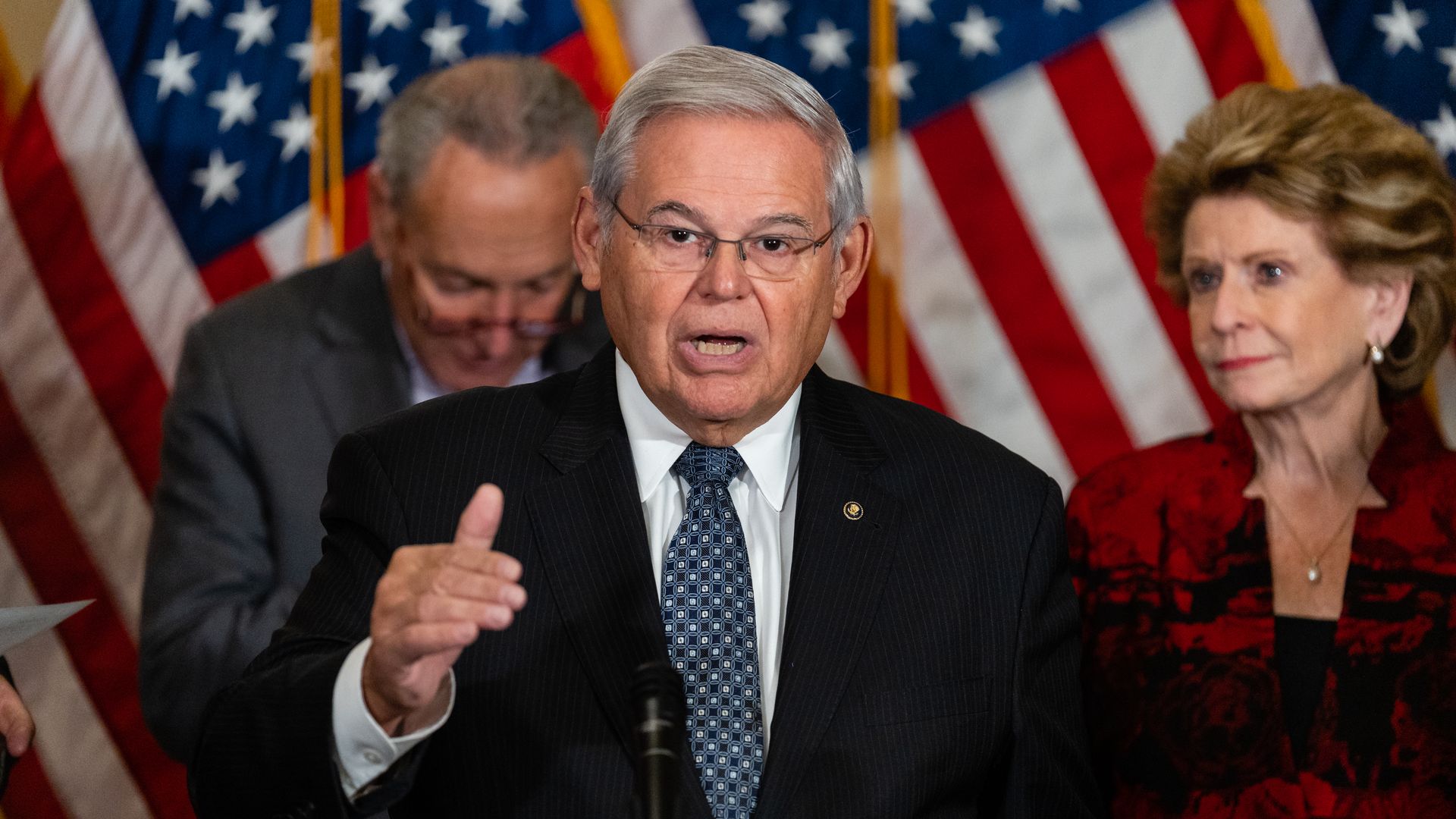 Photo of Bob Menendez speaking while raising his right hand