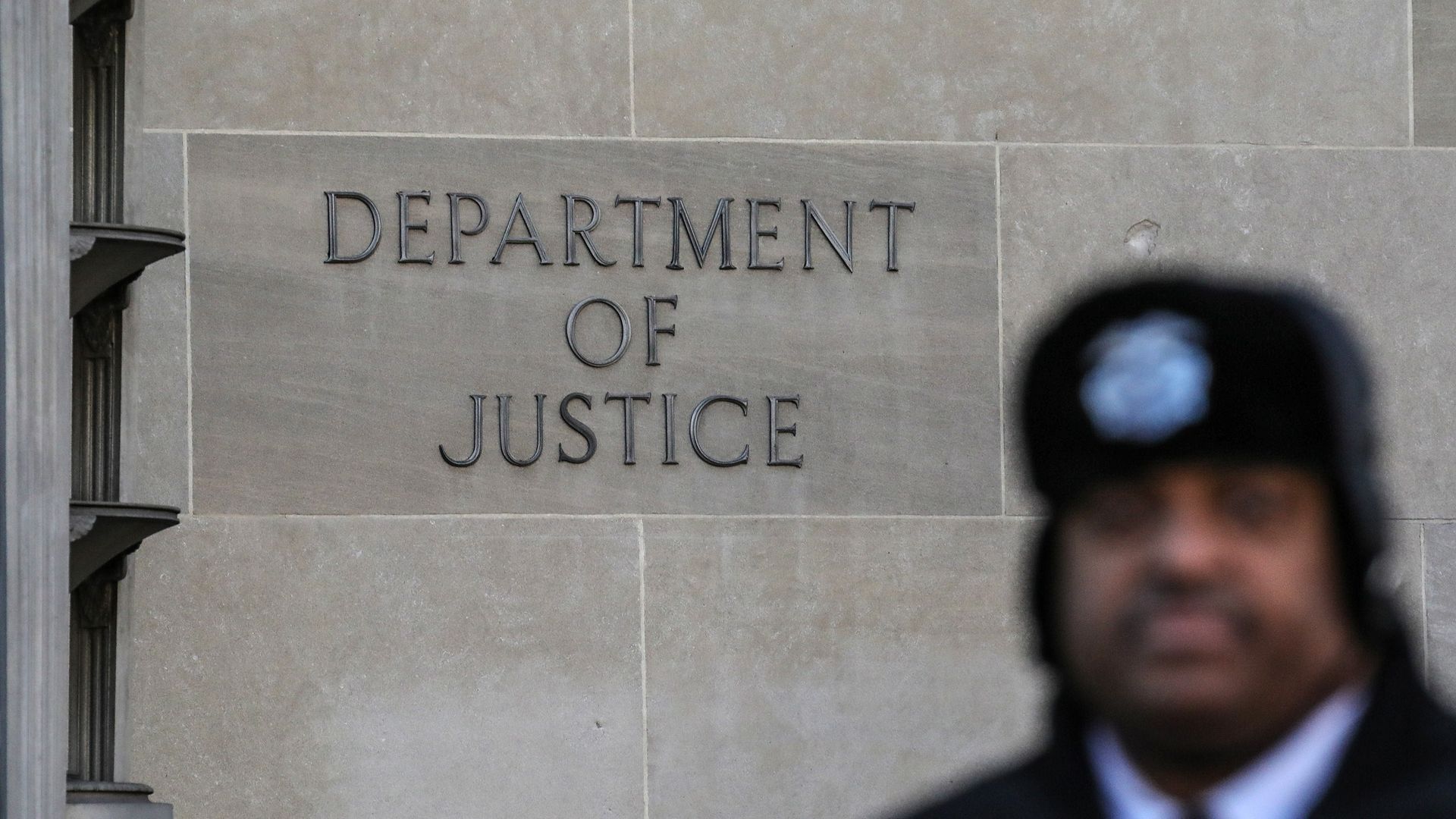 Department of Justice sign on a building 