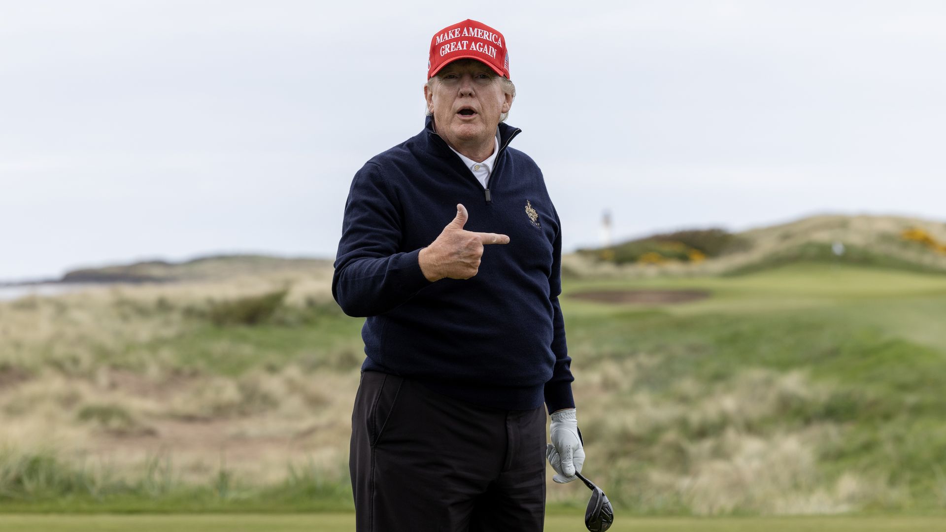 Former U.S. President Donald Trump gestures during a round of golf at his Turnberry course on May 2, 2023 in Turnberry, Scotland. 