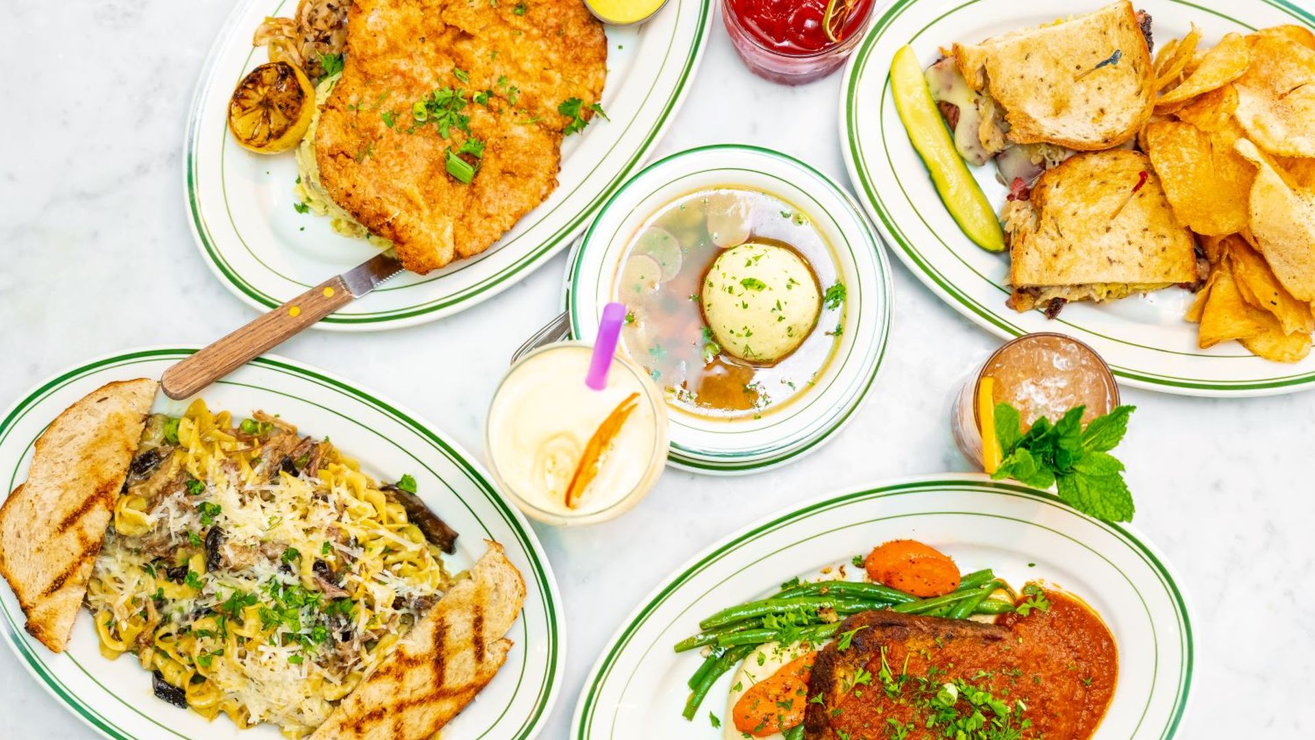 Five plates of food from The Hayden displayed on a table.
