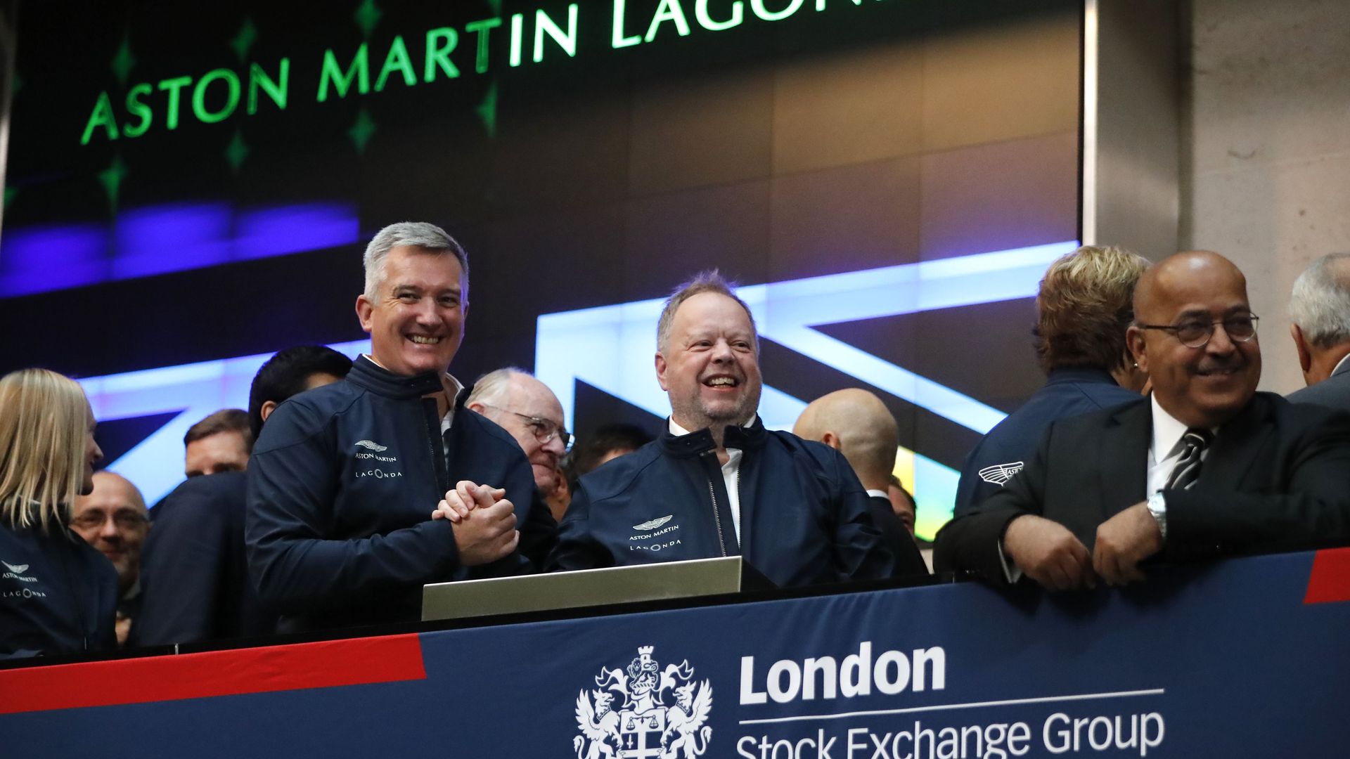 Aston Martin executives celebrate at London Stock Exchange