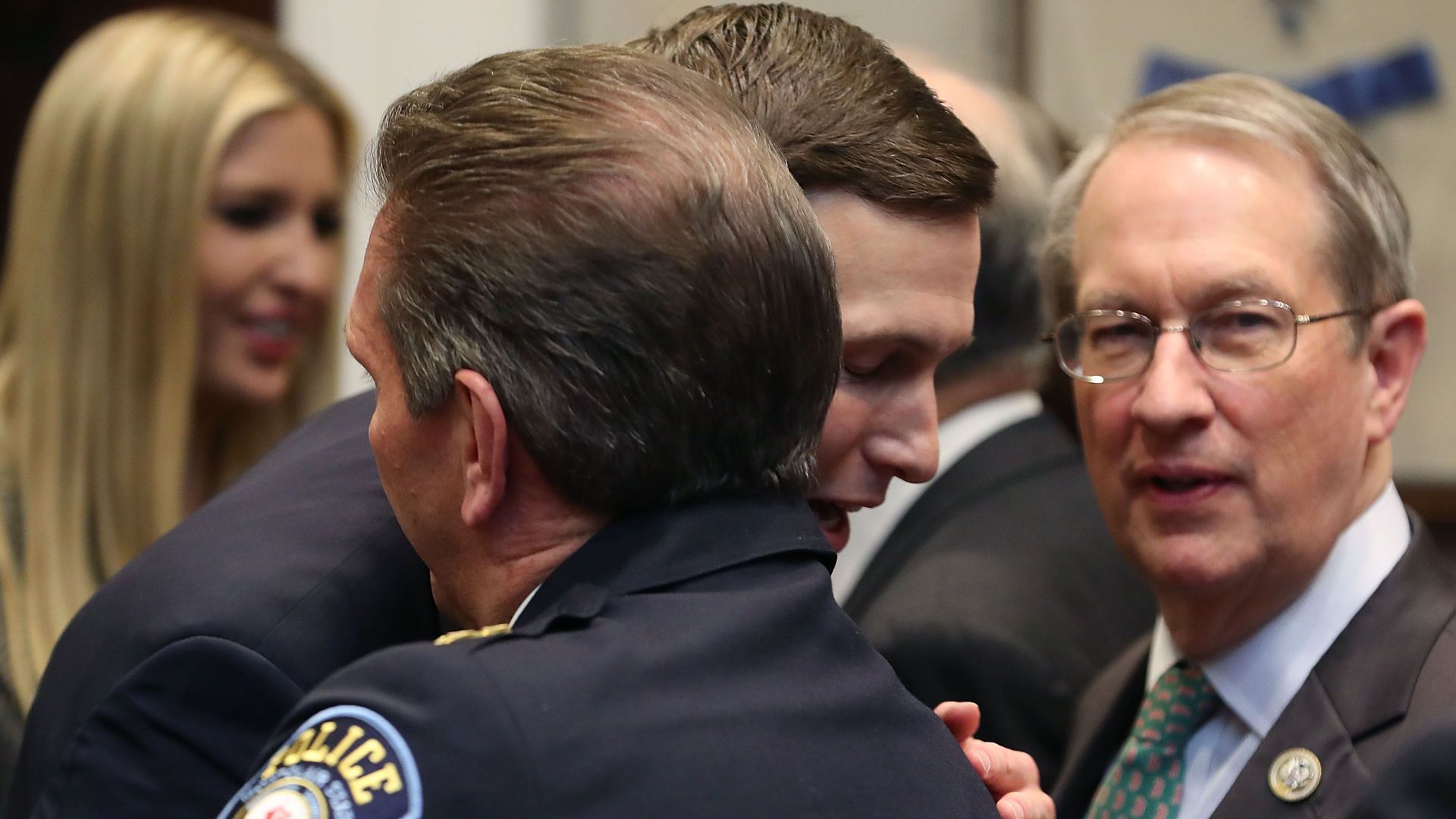 Jared Kushner hugs Paul Cell, president of the International Association of Chiefs of Police