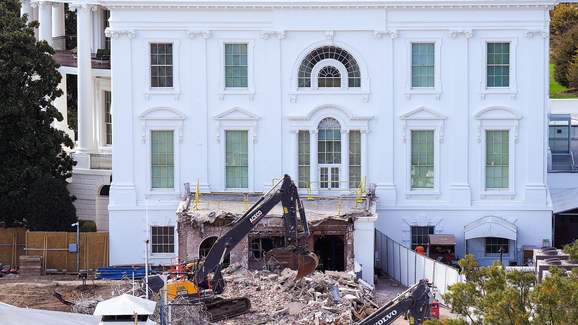  An excavator works to clear rubble after the East Wing of the White House was demolished on October 23, 2025 in Washington, DC. 