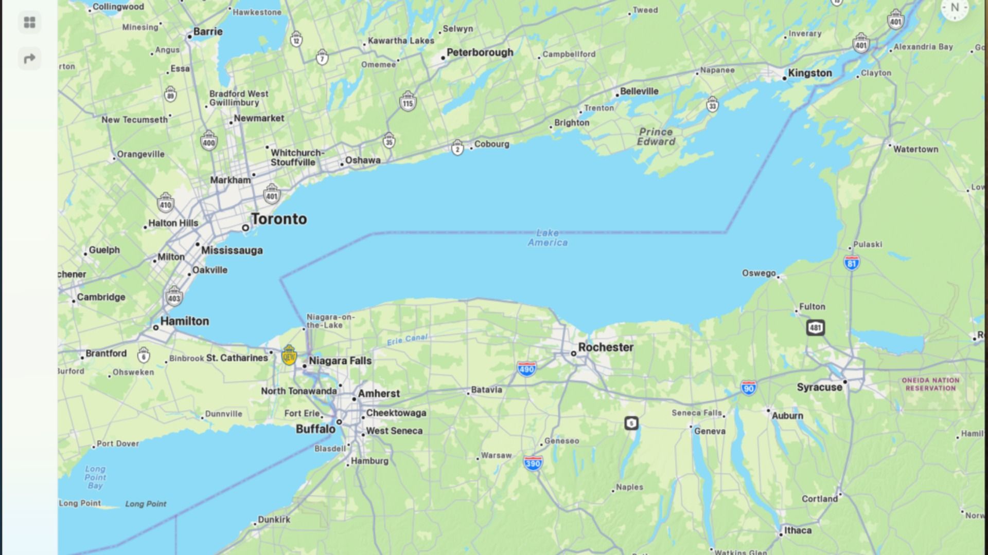 Map view of Lake Ontario with Toronto, Mississauga, Oakville, Hamilton, Oshawa on the Canadian coast and Buffalo, Rochester, Niagara Falls across the lake; green land, blue water, labeled roads.