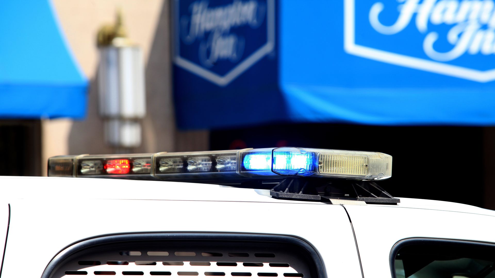 An Indianapolis Police Car sits outside a Hamptons Inn in 2015.